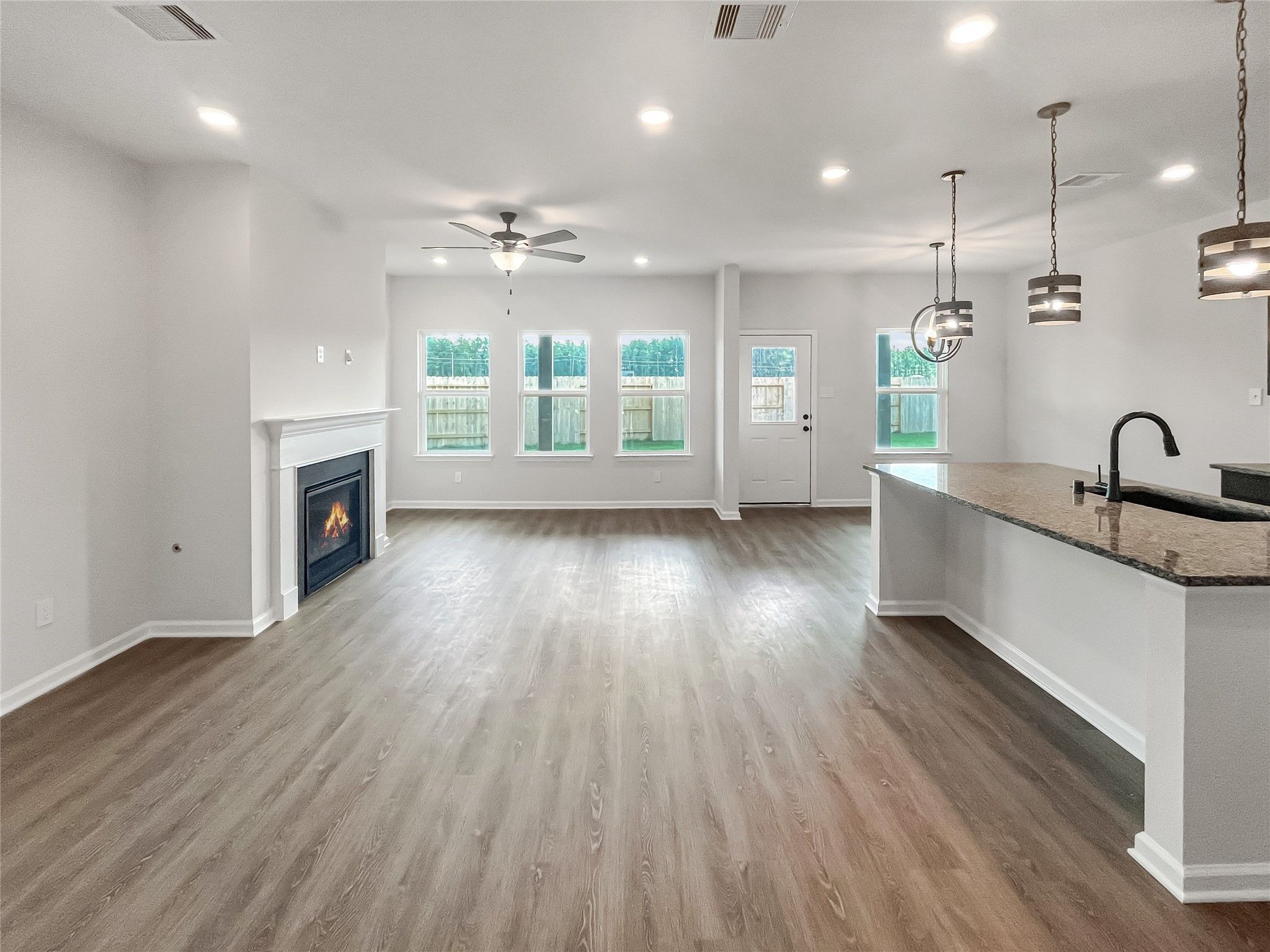 The Princeton II- Family Room with Fireplace into Kitchen.