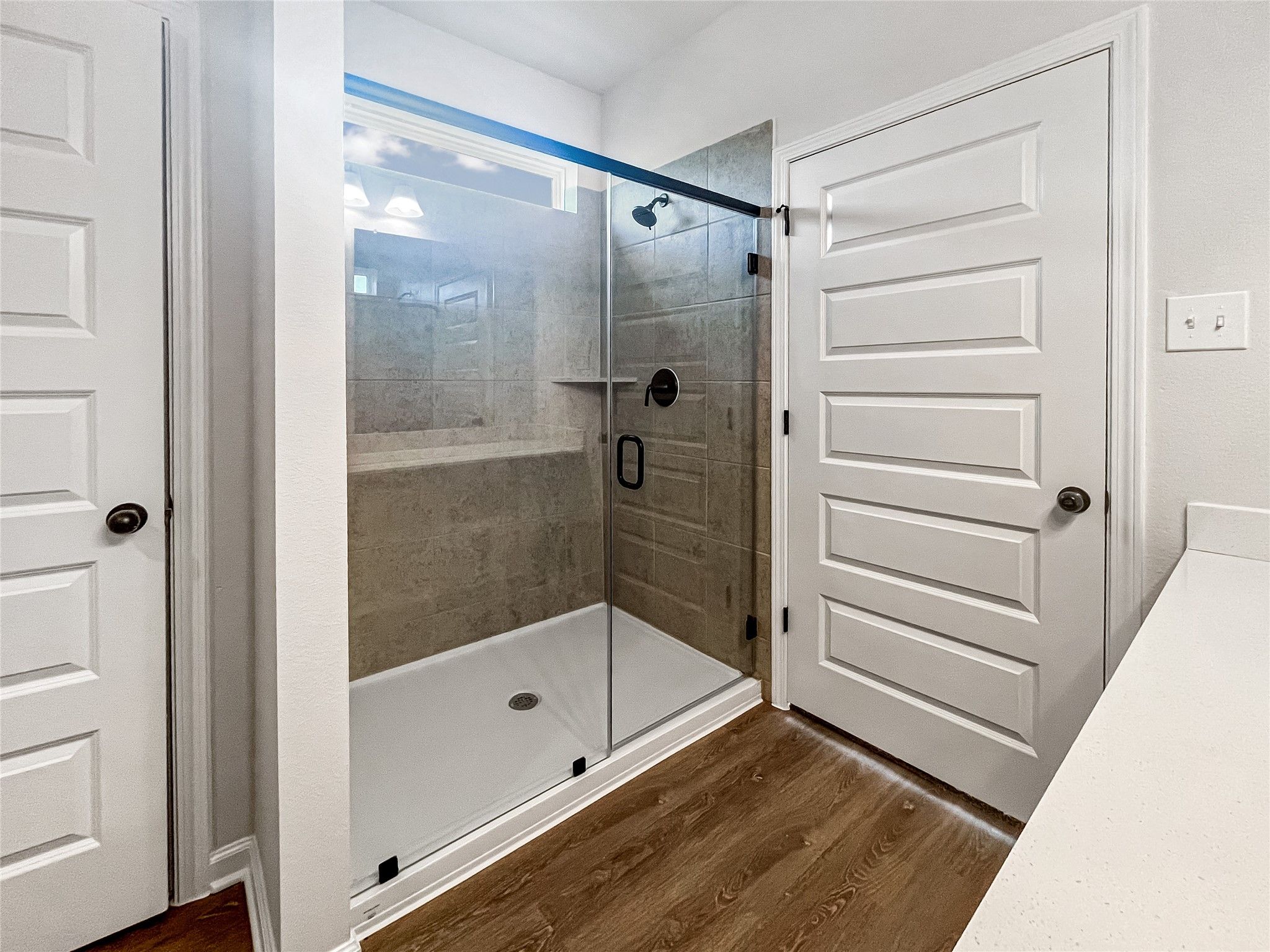 The Princeton II- Primary Bathroom with Dual Vanities and large Walk-in Shower.