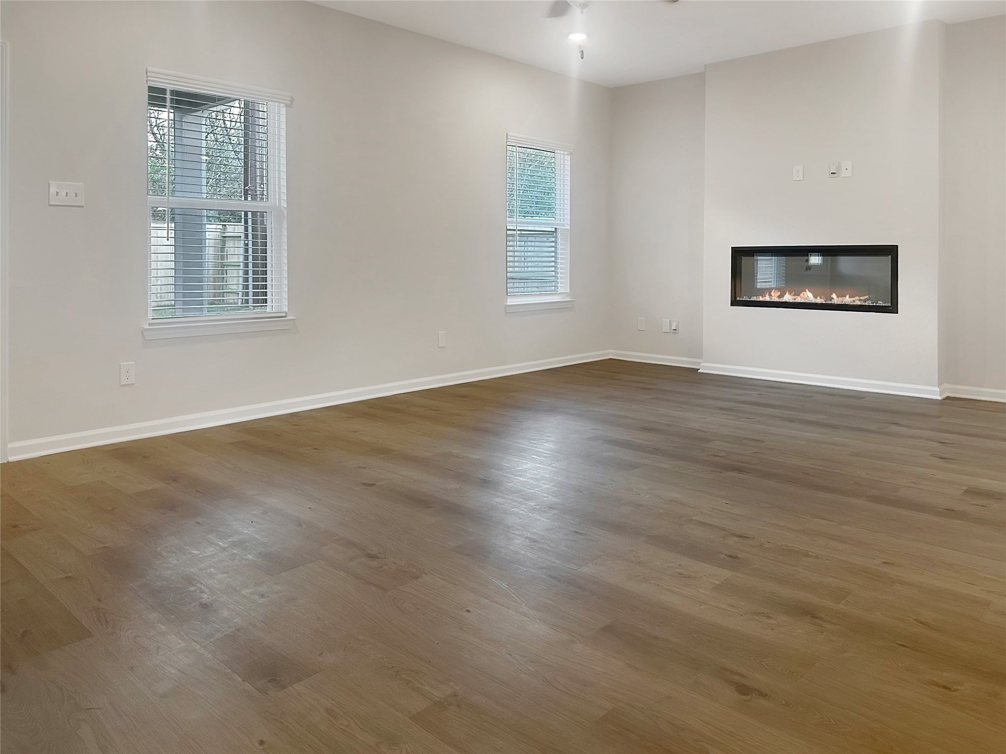 The Crawford- Family Room with Linear Electric Fireplace. Home is under construction, photos used f