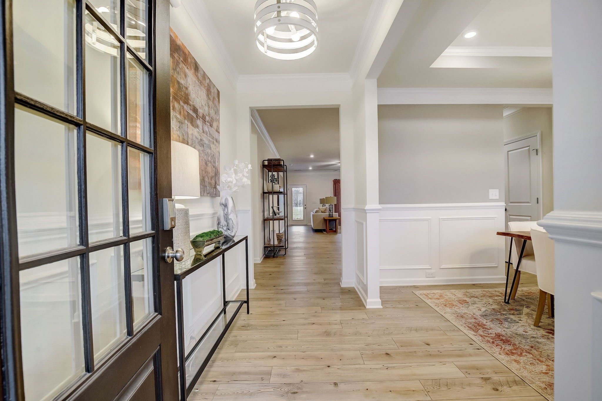 The Palmer- Foyer into the Dining Room. The sample image is a staged model, to be used for illustra