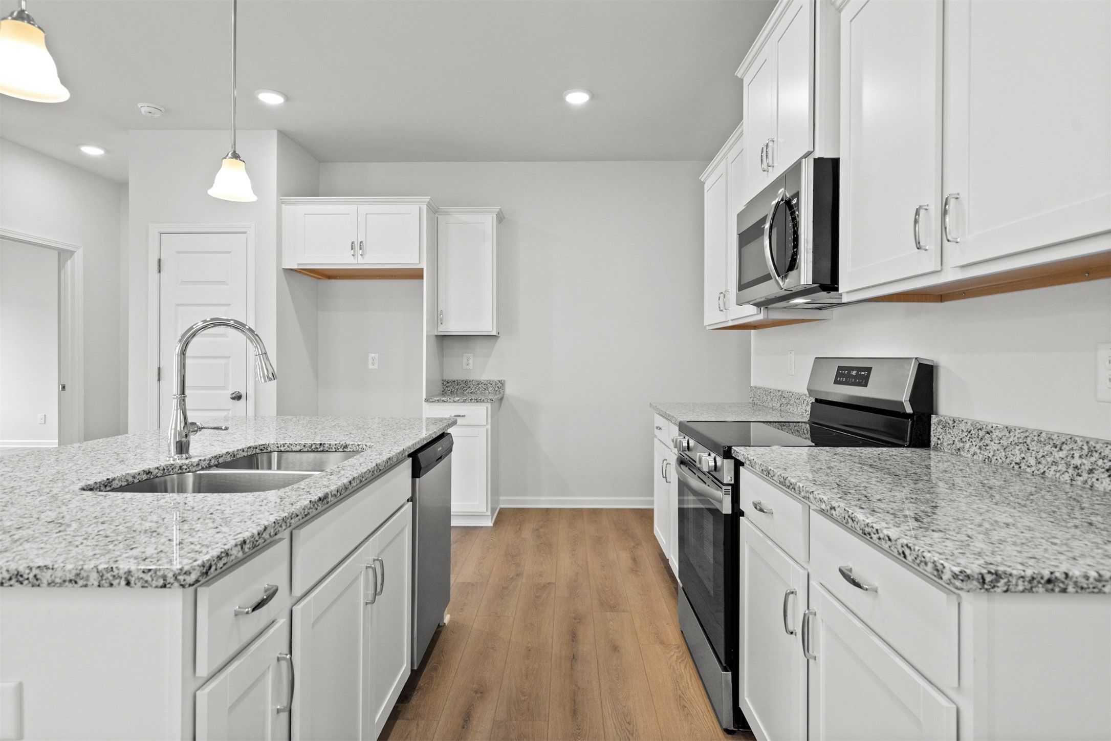 The Dove- Kitchen. Home under construction, photo used for illustrative purposes only, colors and o