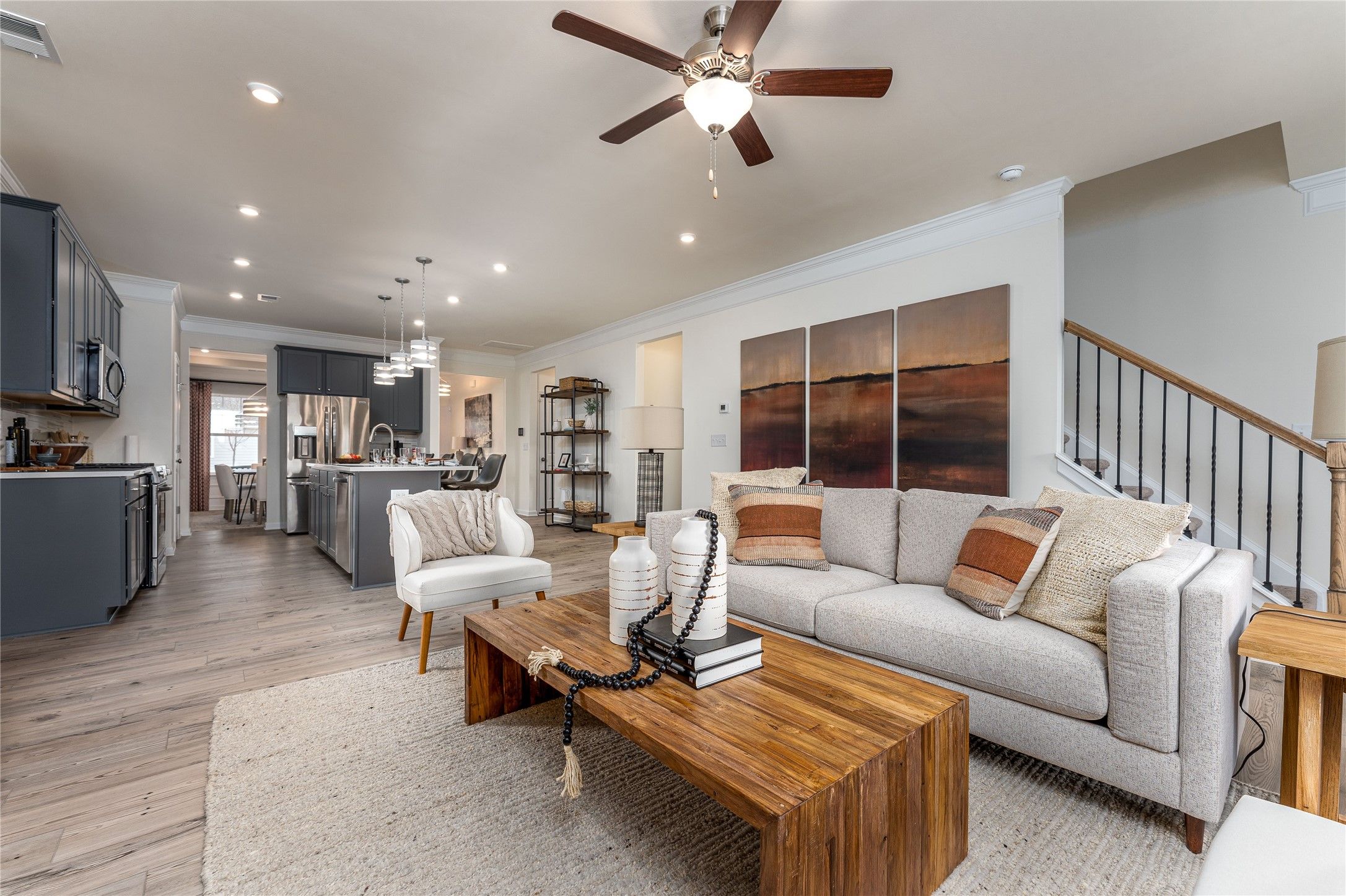 The Palmer- Family Room into the Kitchen. The sample image is a staged model, to be used for illust