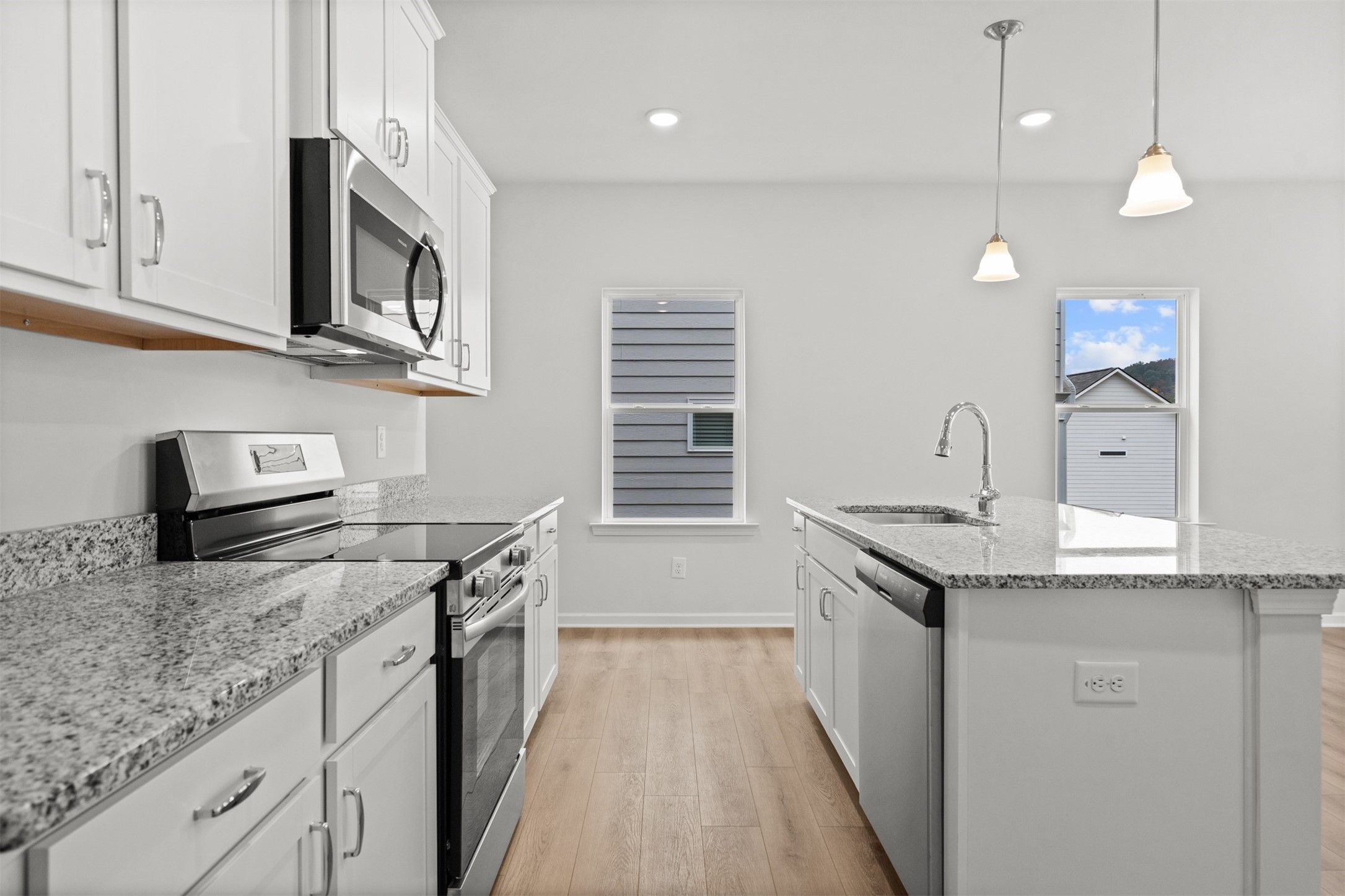 The Dove- Kitchen. Home under construction, photo used for illustrative purposes only, colors and o