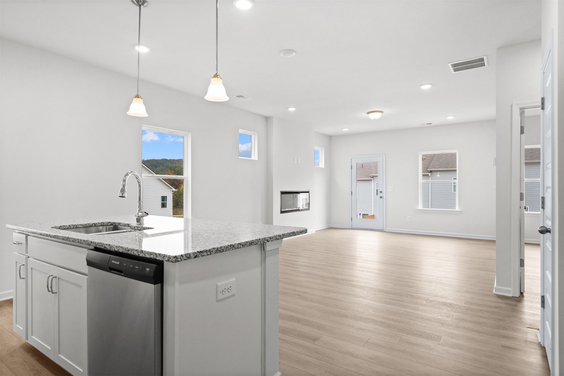 The Dove- Kitchen into the Family Room. Home under construction, photo used for illustrative purpos
