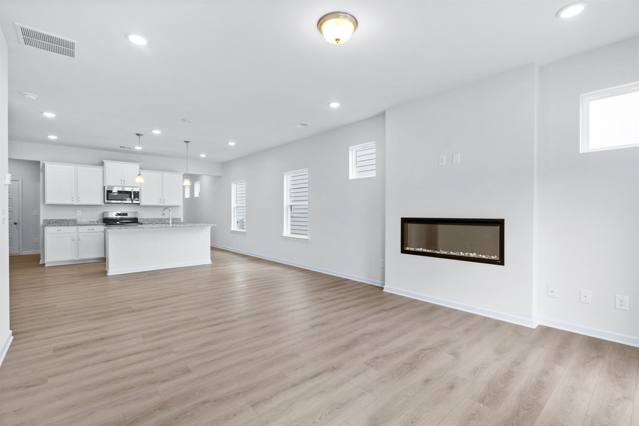 The Dove- Family Room into the Kitchen. Home under construction, photo used for illustrative purpos