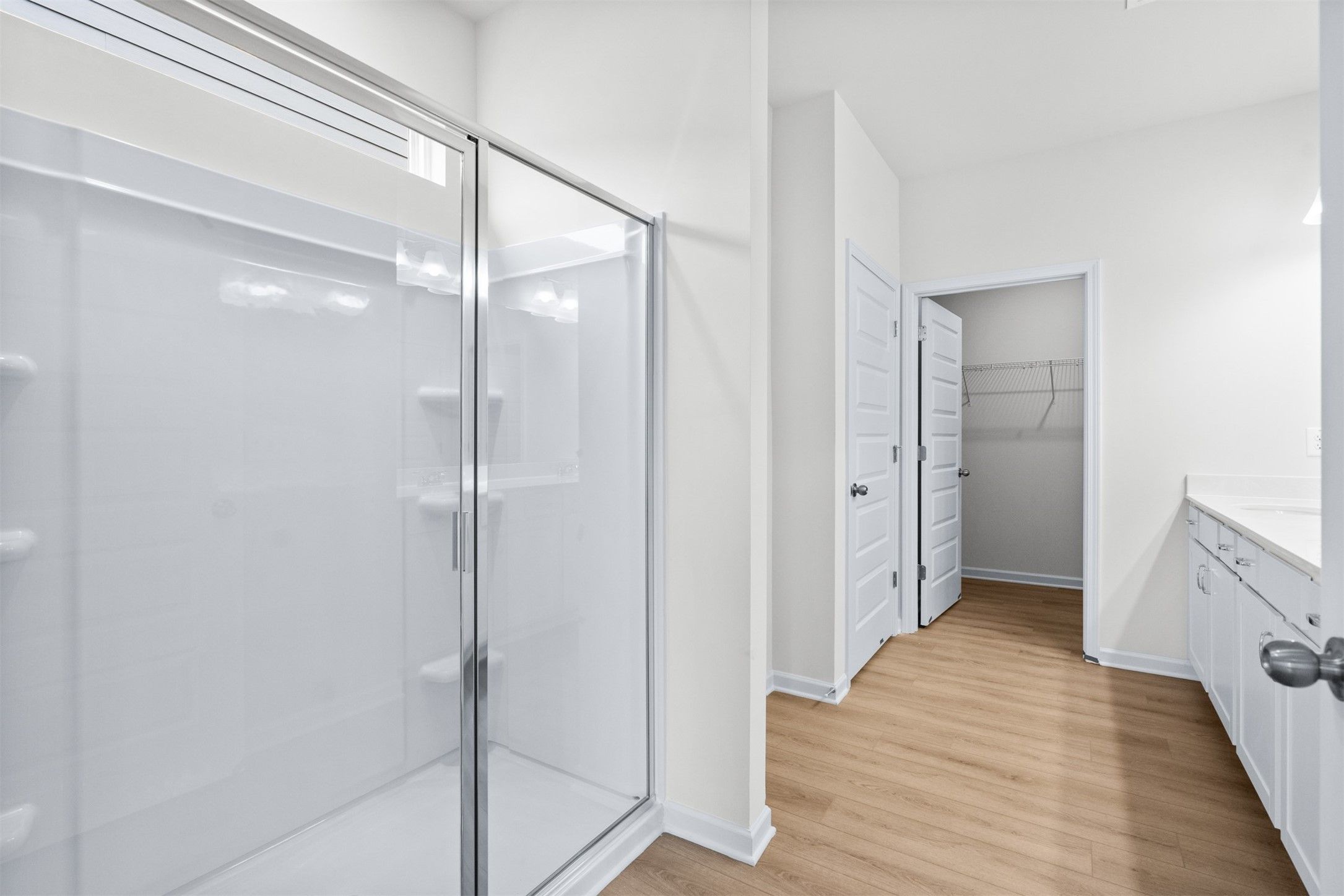 The Dove- Primary Suite with Dual Vanities and Walk-In Shower.