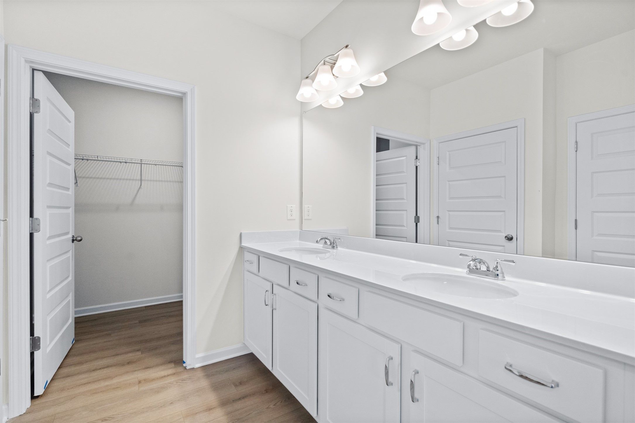 The Dove- Primary Suite with Dual Vanities. Home under construction, photo used for illustrative pu