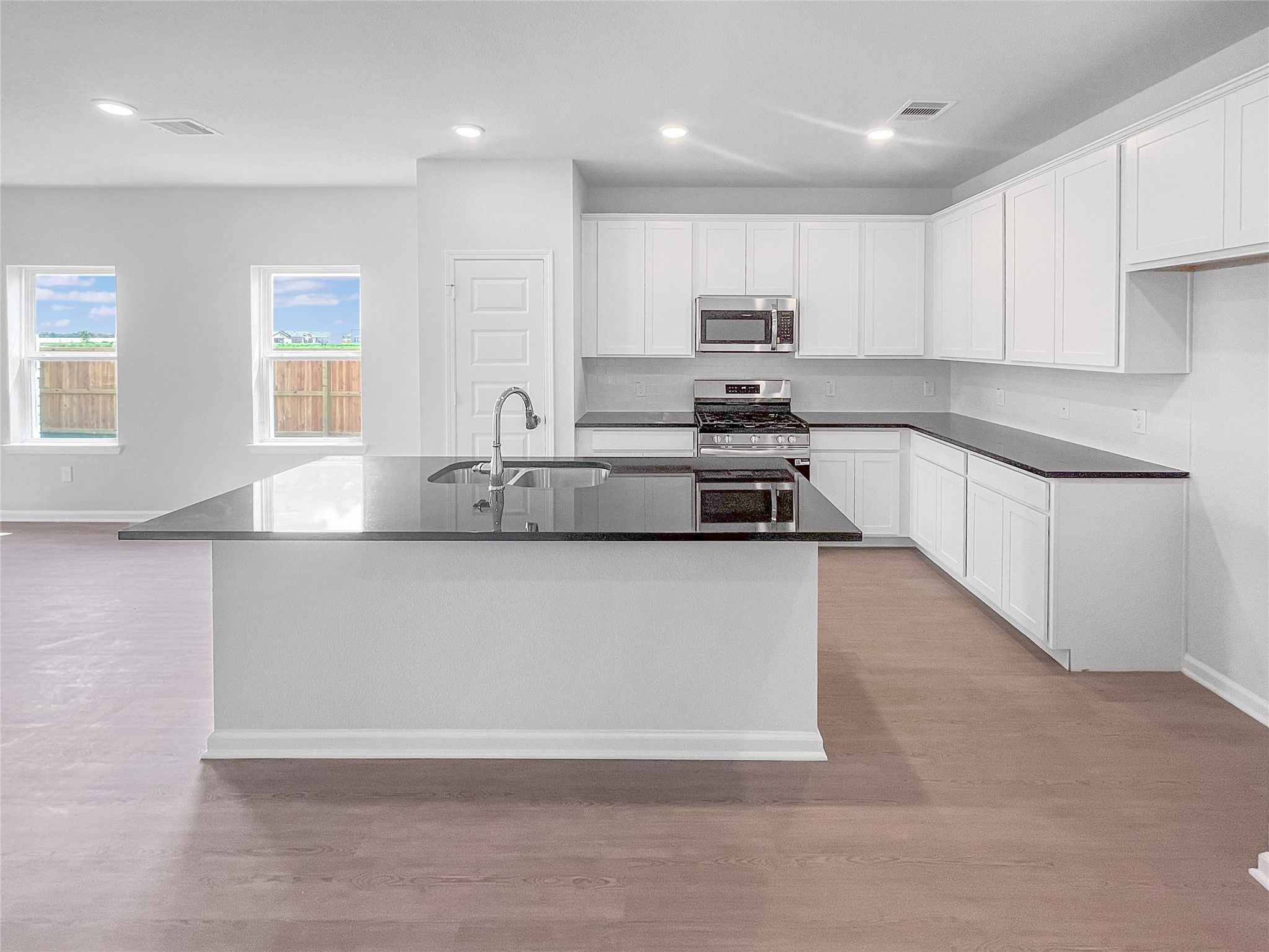 The Waring III- Kitchen with Large Island. Sample image for illustration; upgrades, options, and co