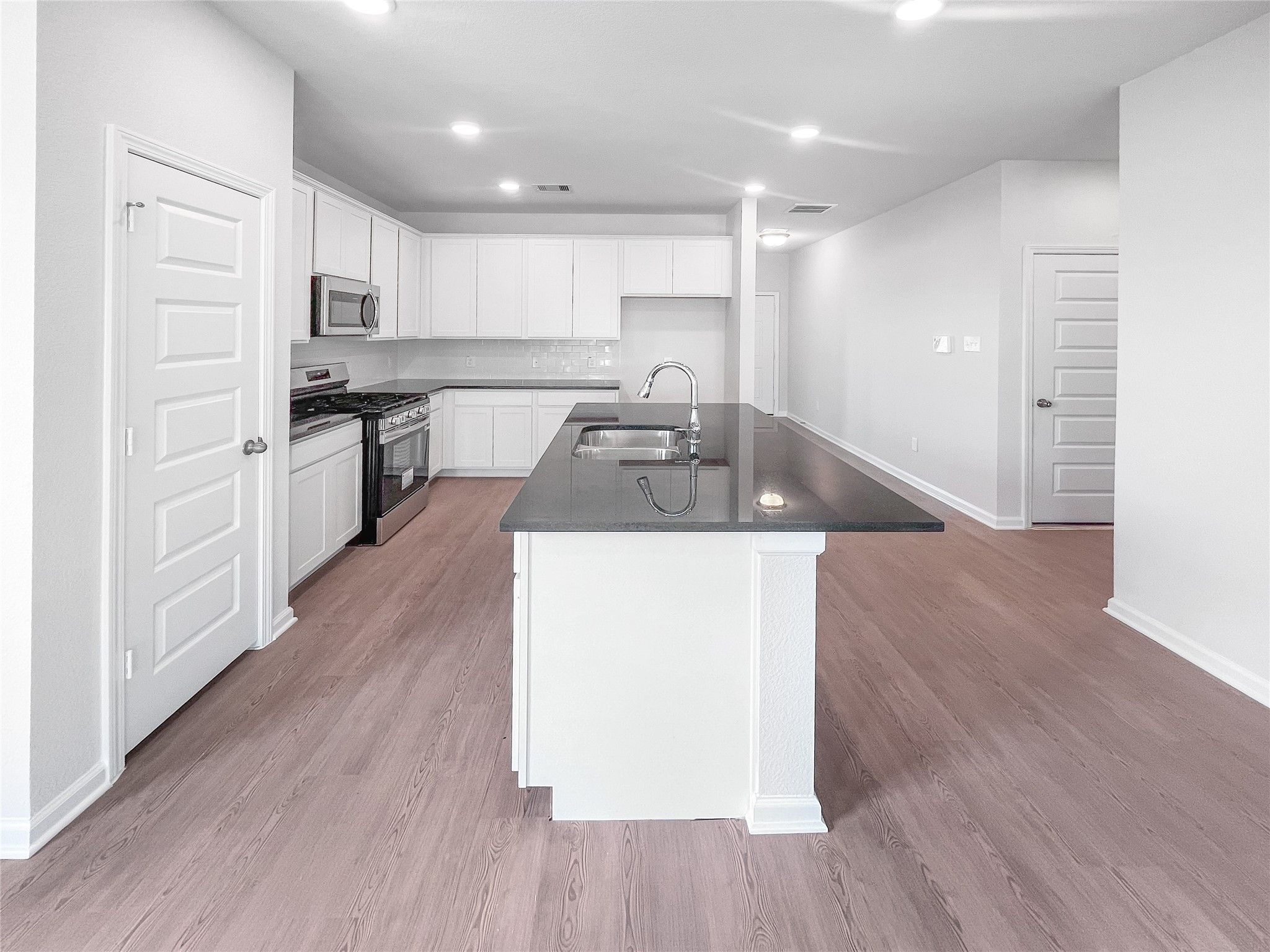 The Waring III- Kitchen with Large Island. Sample image for illustration; upgrades, options, and co