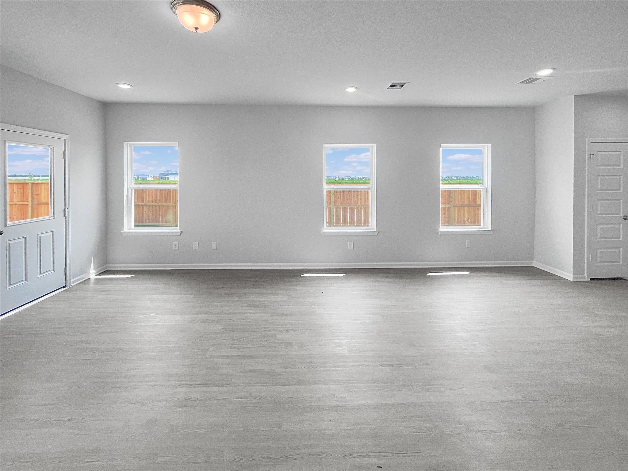 The Waring III- Dining Area and Family Room. Sample image for illustration; upgrades, options, and