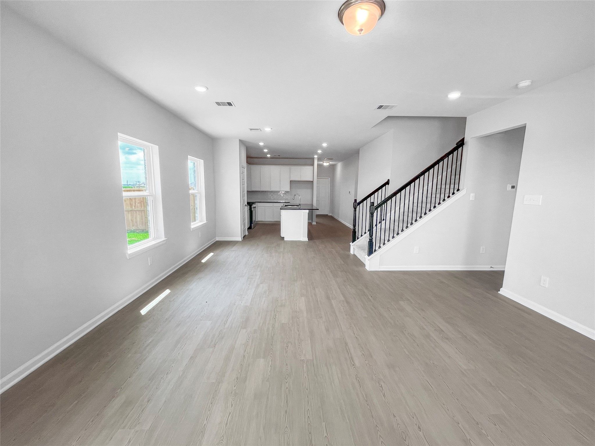 The Waring III- Family Room into Dining Area and Kitchen. Sample image for illustration; upgrades,
