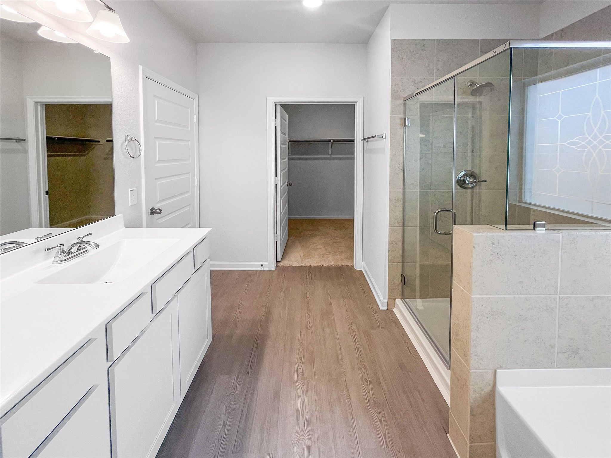 The Waring III- Primary Bathroom with Dual Vanities, Separate Garden tub and Walk-in Shower. Sample