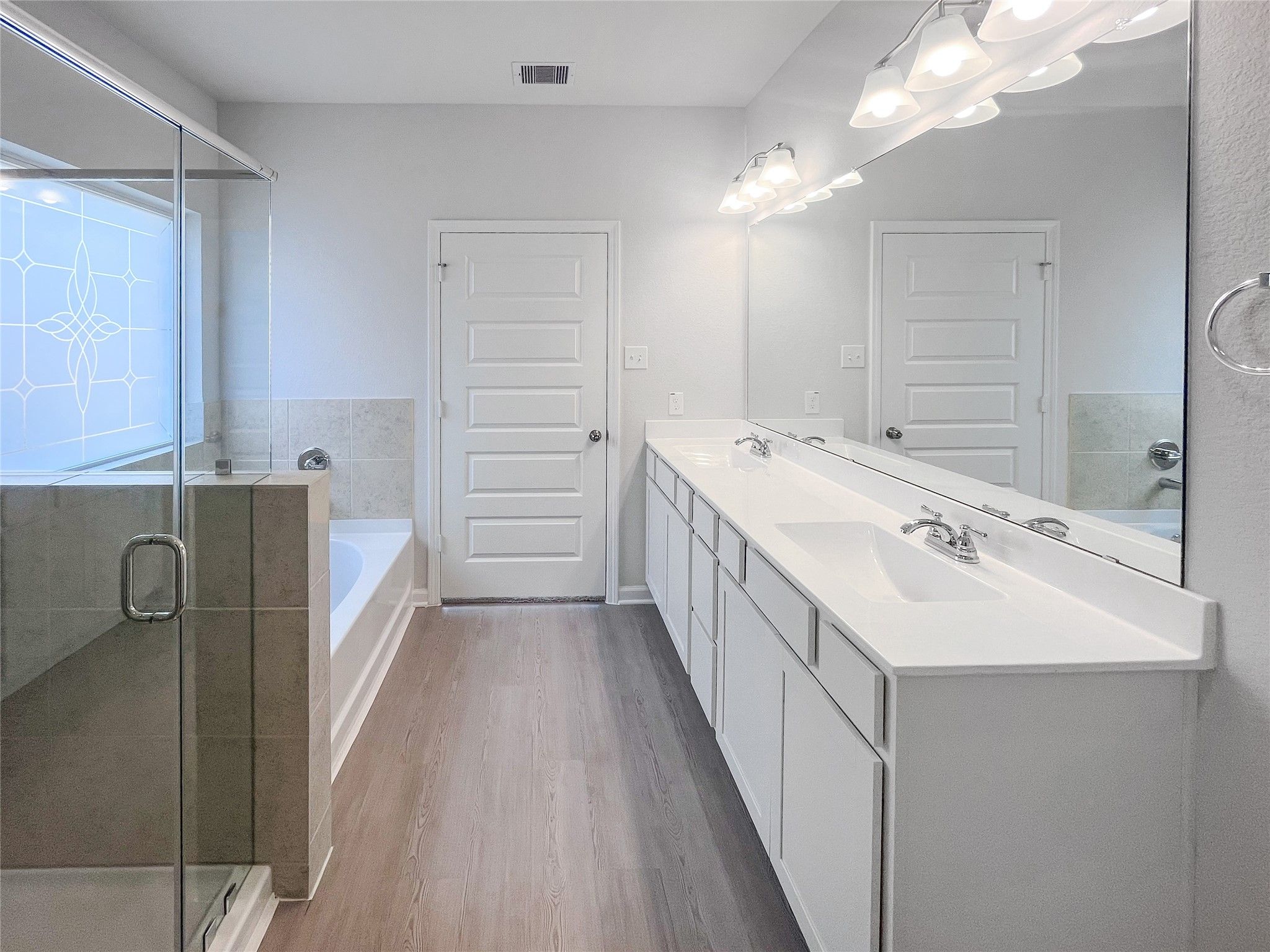 The Waring III- Primary Bathroom with Dual Vanities, Separate Garden tub and Walk-in Shower. Sample