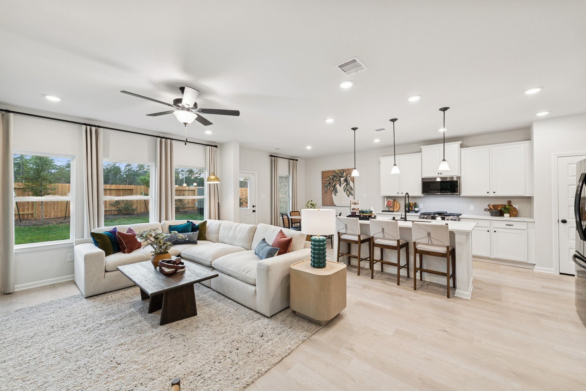 The Princeton II- Family Room and Kitchen. Staged model home shown for illustration only; actual fe
