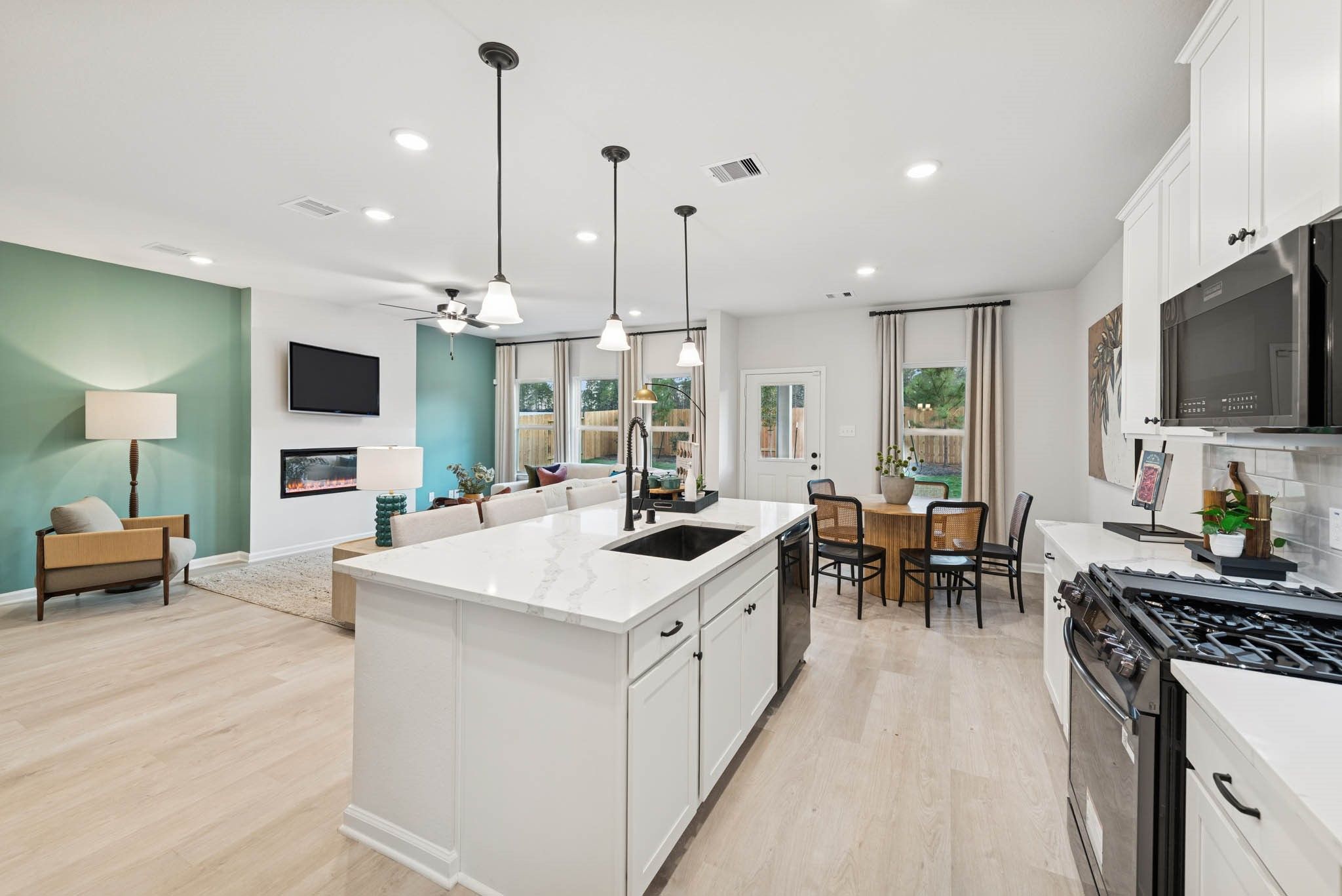 The Princeton II- Kitchen into the Family Room. Staged model home shown for illustration only; actu
