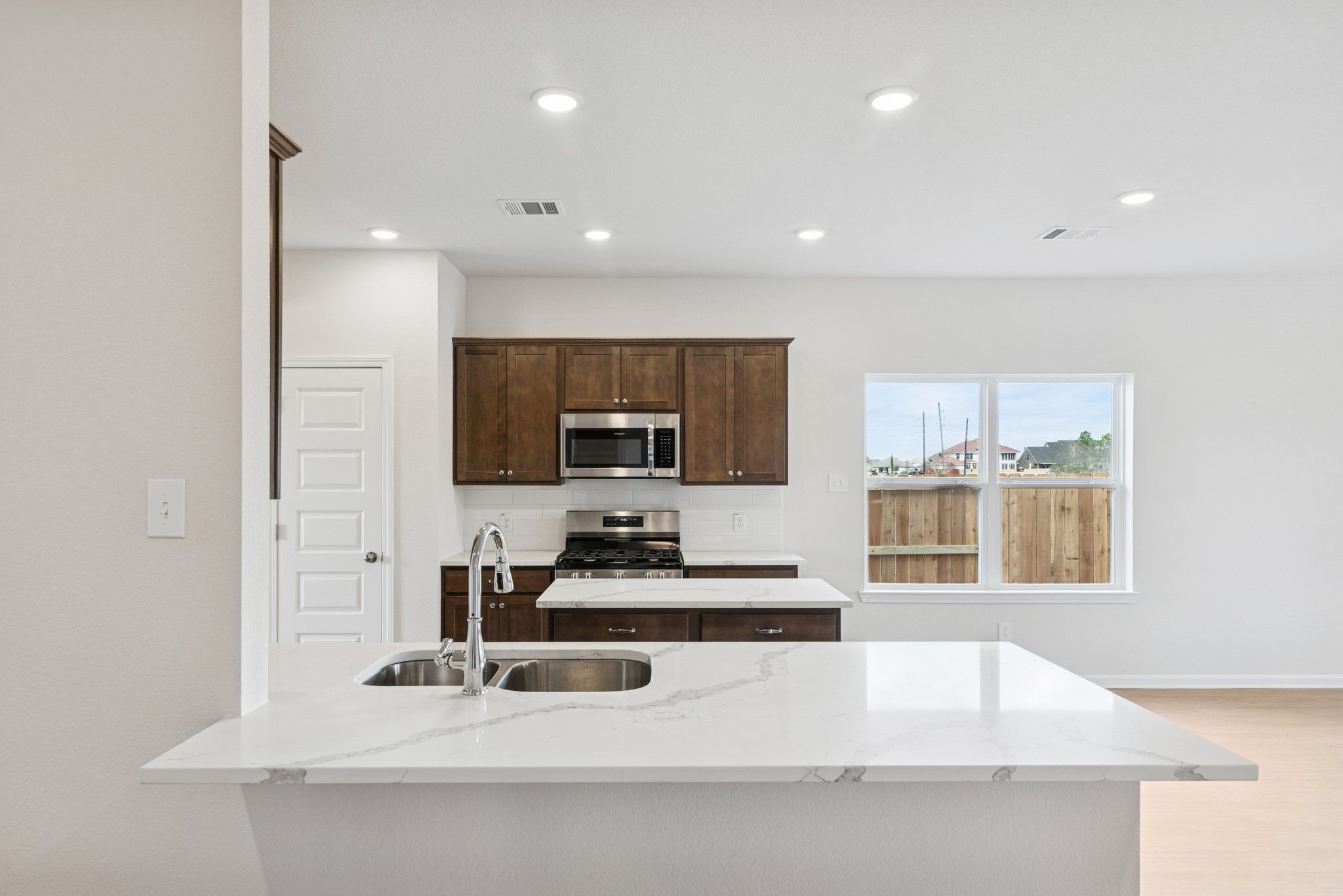The Georgetown II- Kitchen. Home under construction, photo used for illustrative purposes only, col