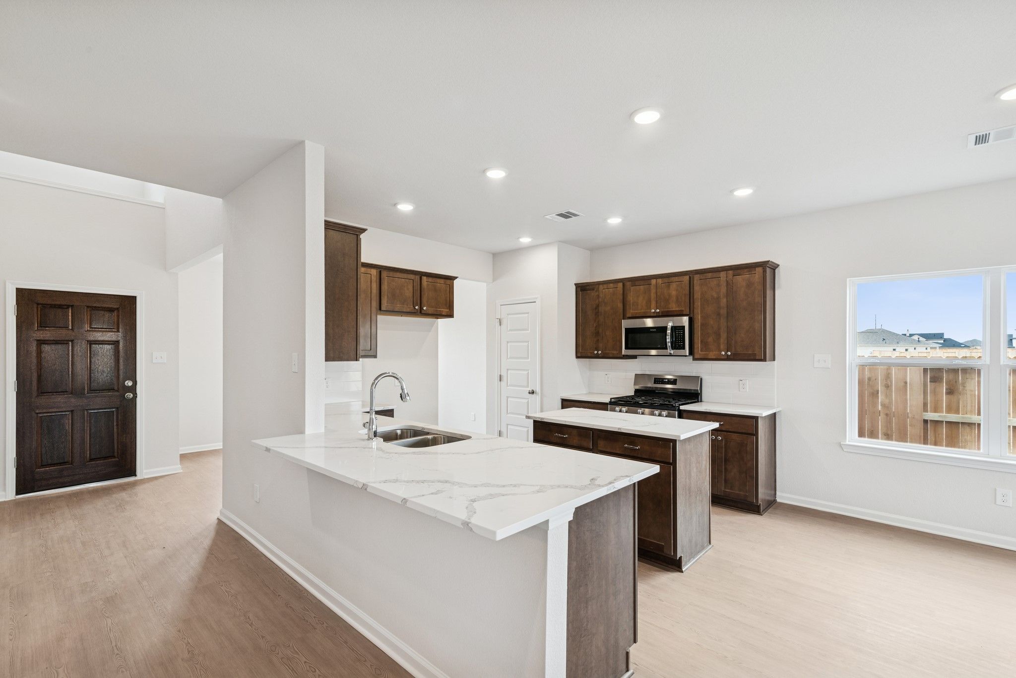 The Georgetown II- Kitchen. Home under construction, photo used for illustrative purposes only, col