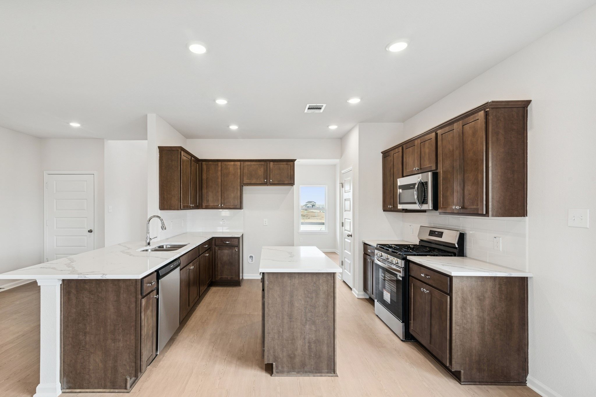 The Georgetown II- Kitchen. Home under construction, photo used for illustrative purposes only, col