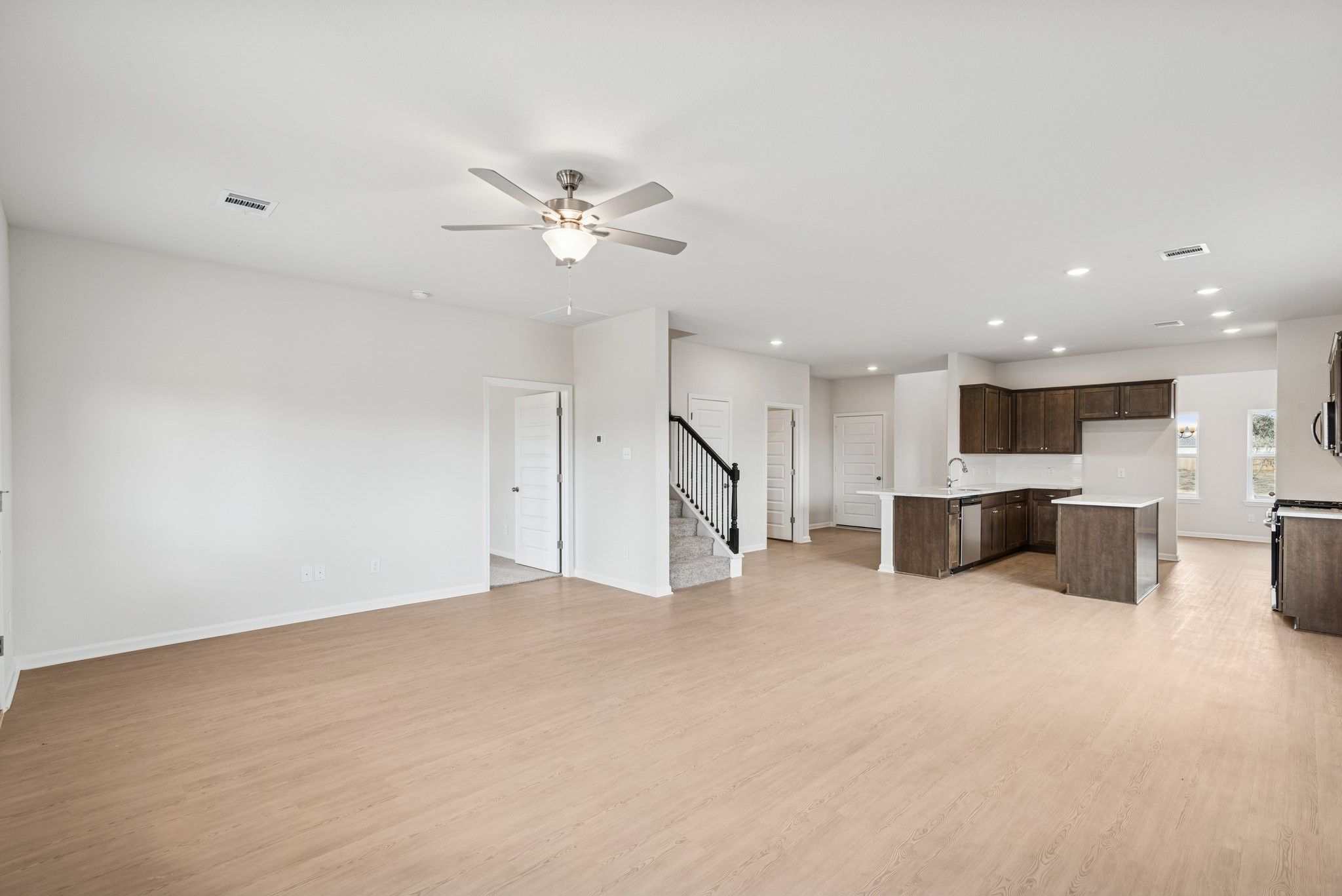 The Georgetown II- Family Room into Breakfast Area and Kitchen. Home under construction, photo used
