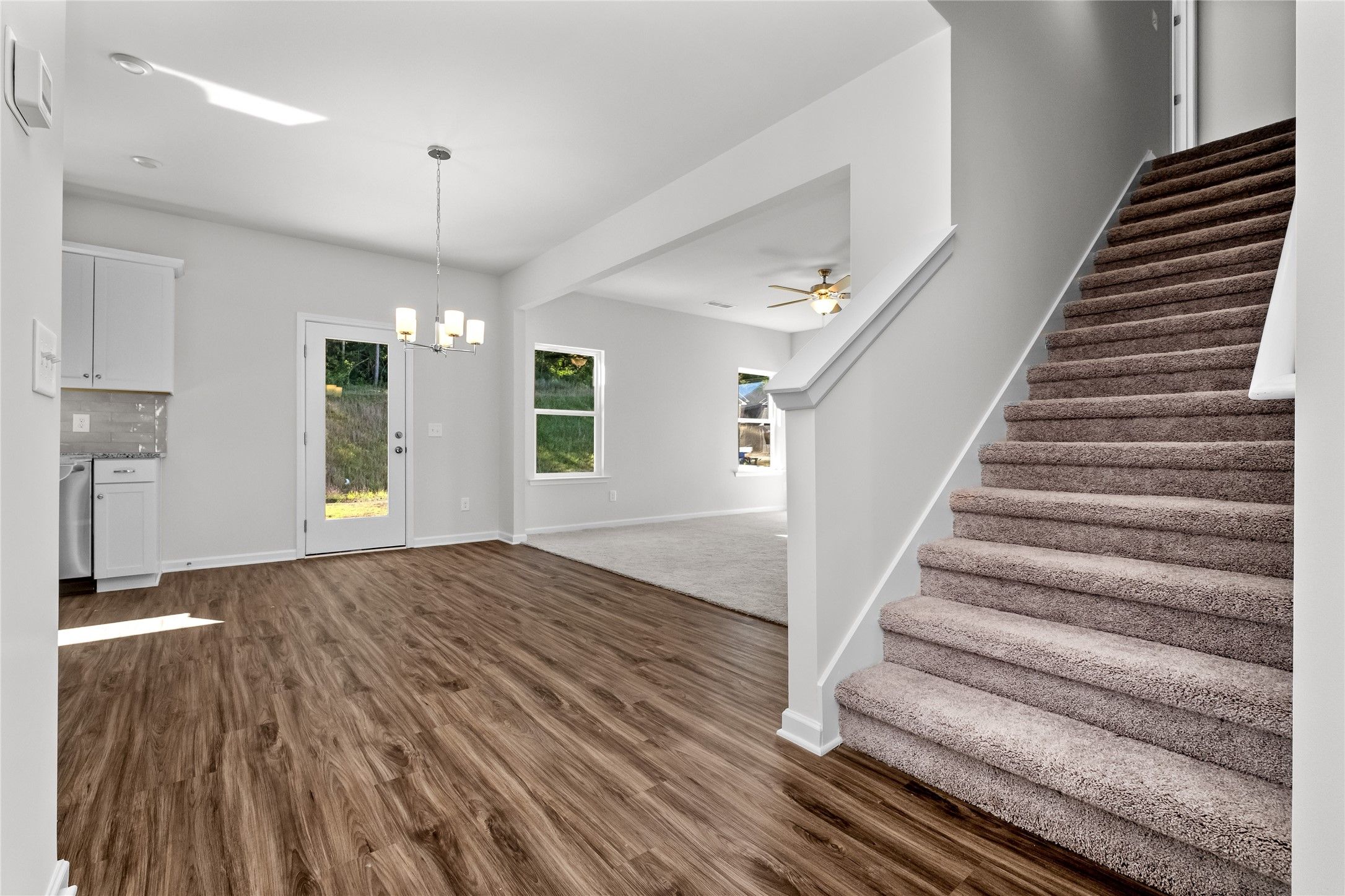 The Coleman- Staircase to bedrooms and family room view. Home under construction, photo used for il
