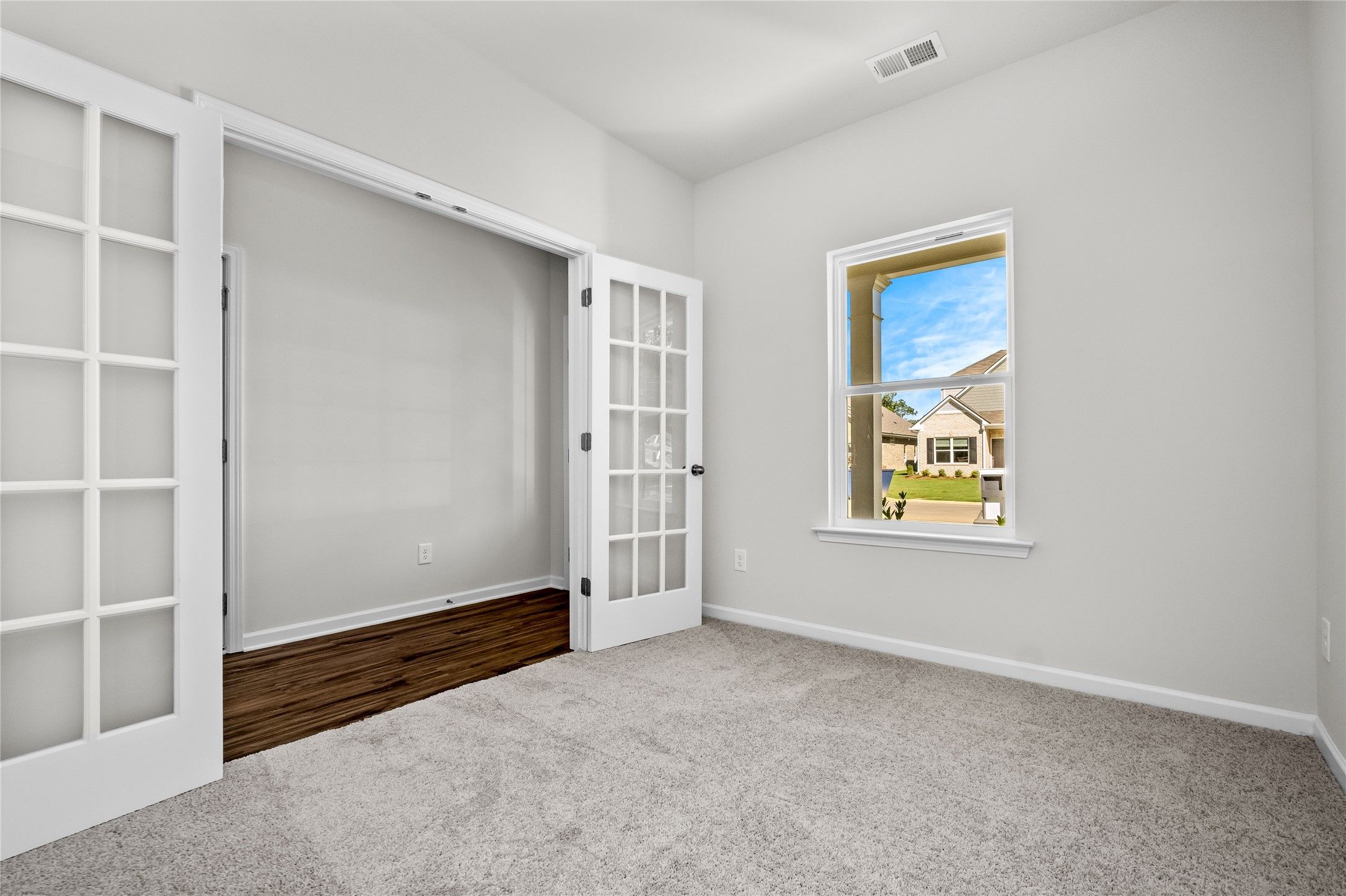 The Coleman- Study with French doors. Home under construction, photo used for illustrative purposes