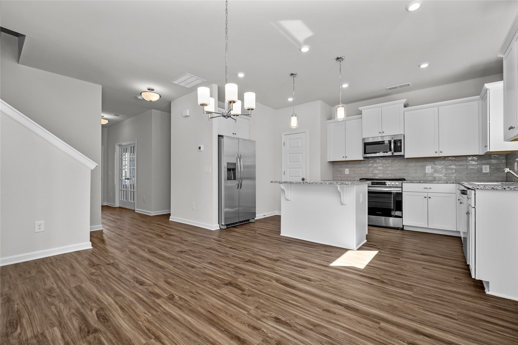 The Coleman- Dining Area into Kitchen. Home under construction, photo used for illustrative purpose