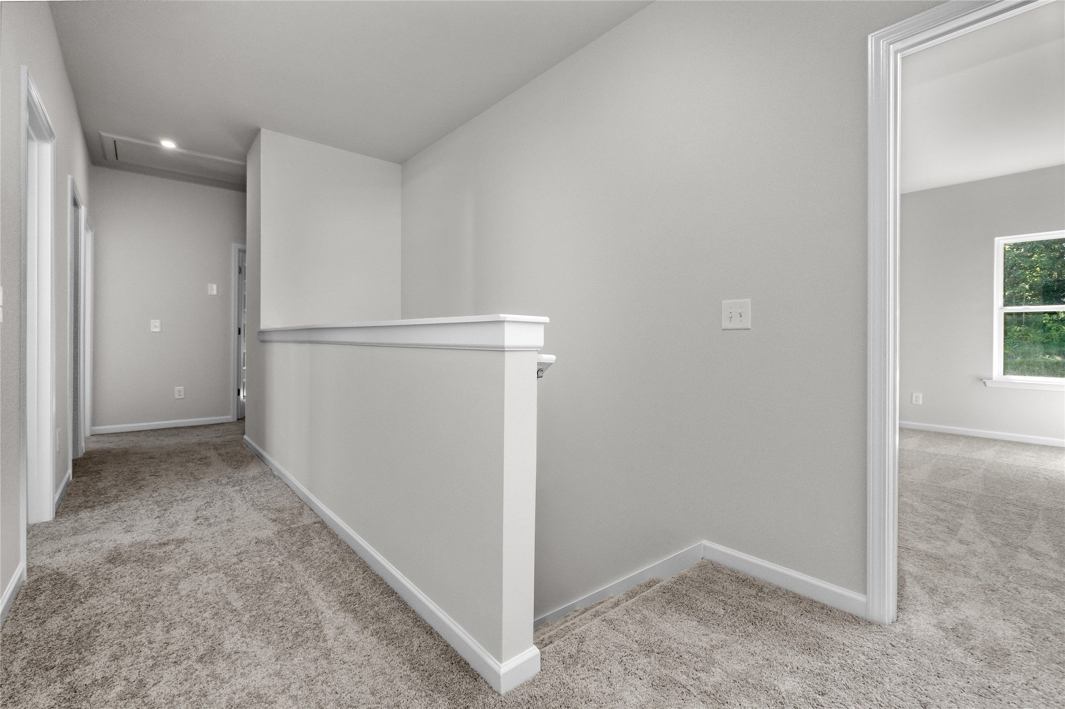 The Coleman- 2nd floor landing into the Primary Bedroom. Home under construction, photo used for il