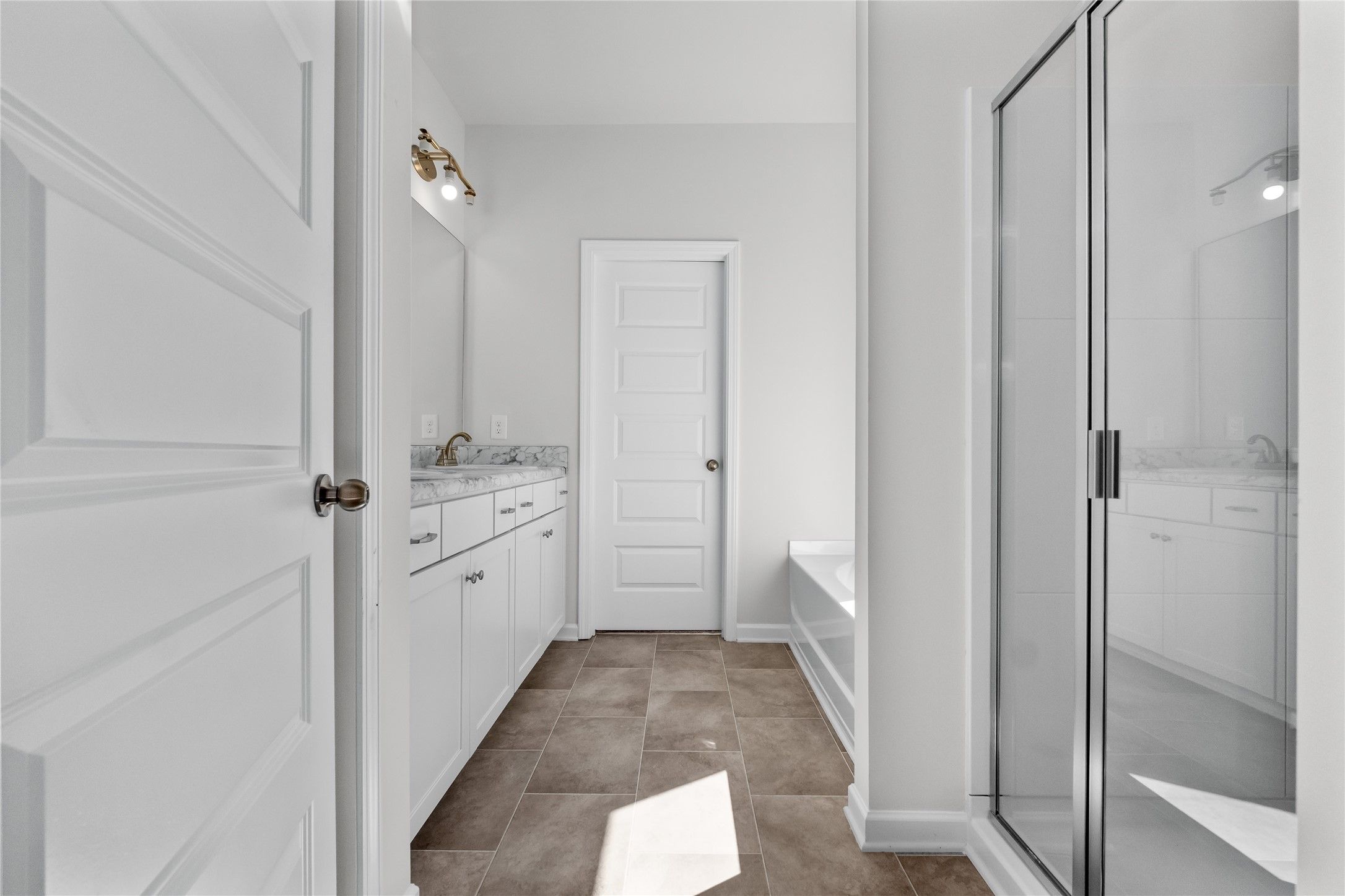 The Coleman- Primary Bathroom with Separate Tub and Shower. Home under construction, photo used for