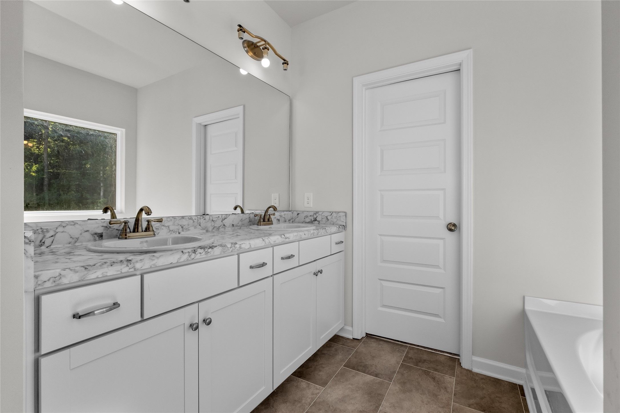 The Coleman- Primary Bathroom with Dual Vanities. Home under construction, photo used for illustrat