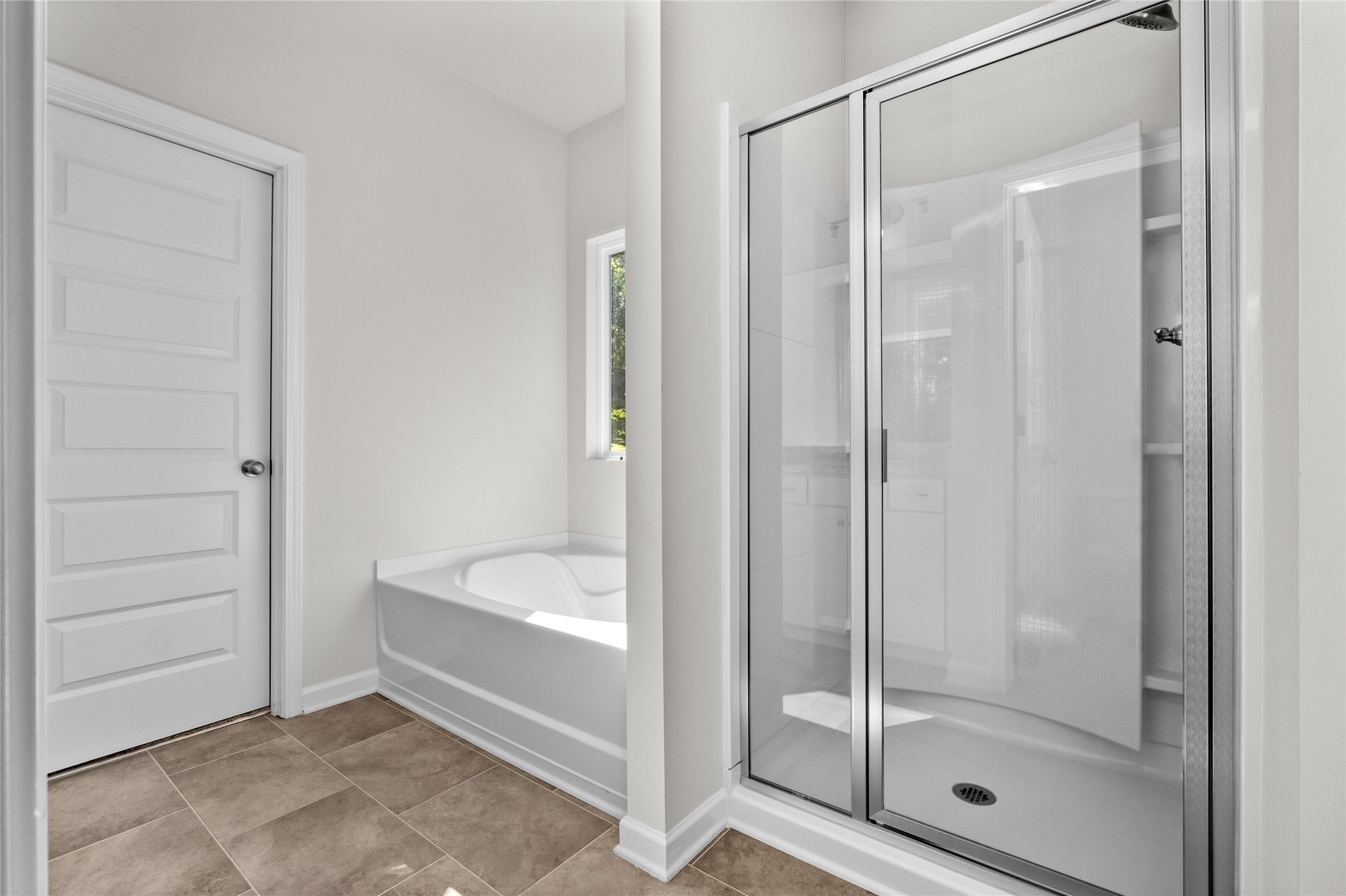 The Coleman- Primary Bathroom with Separate Tub and Shower. Home under construction, photo used for