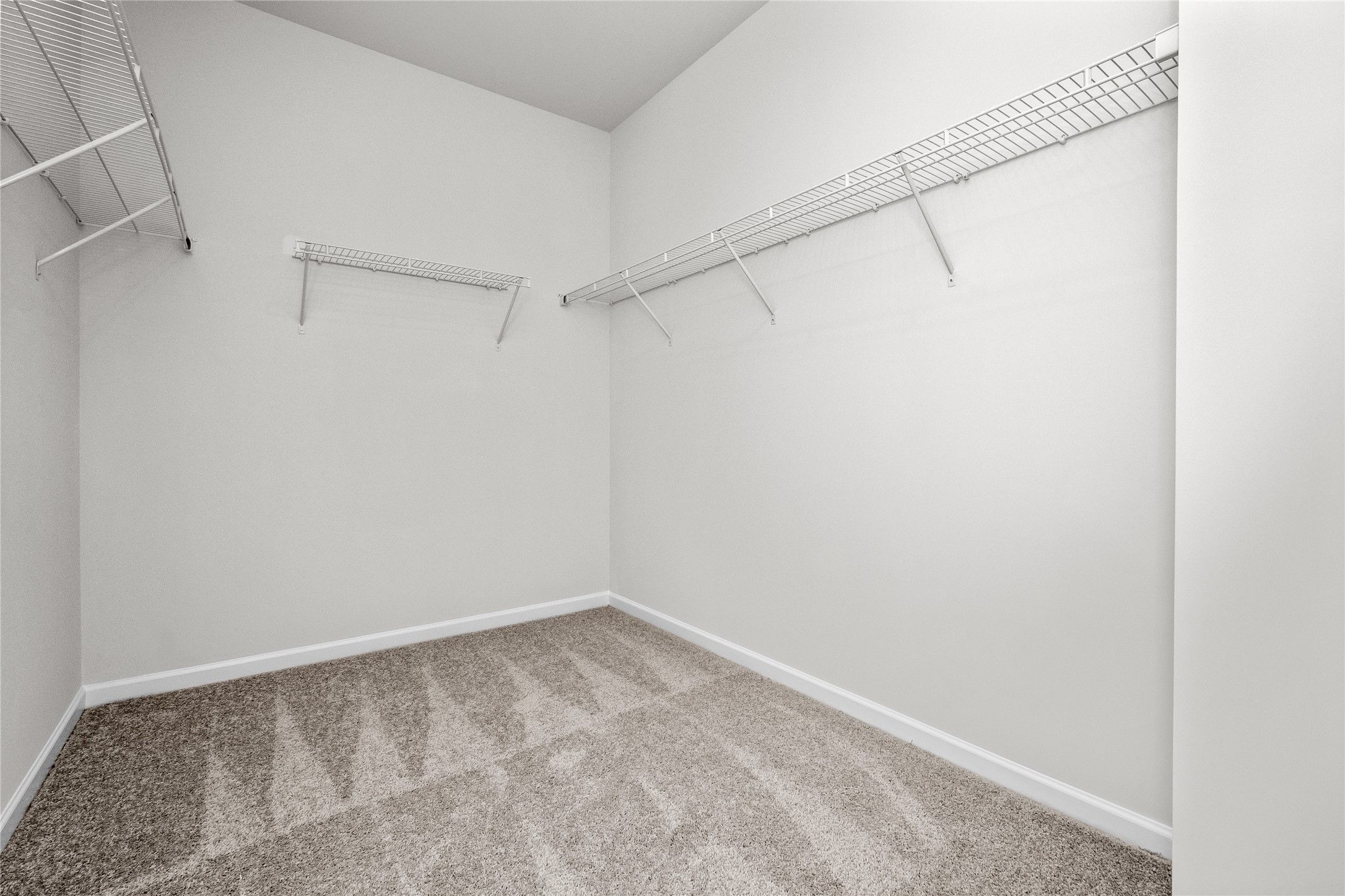 The Coleman- Primary Walk-in Closet. Home under construction, photo used for illustrative purposes