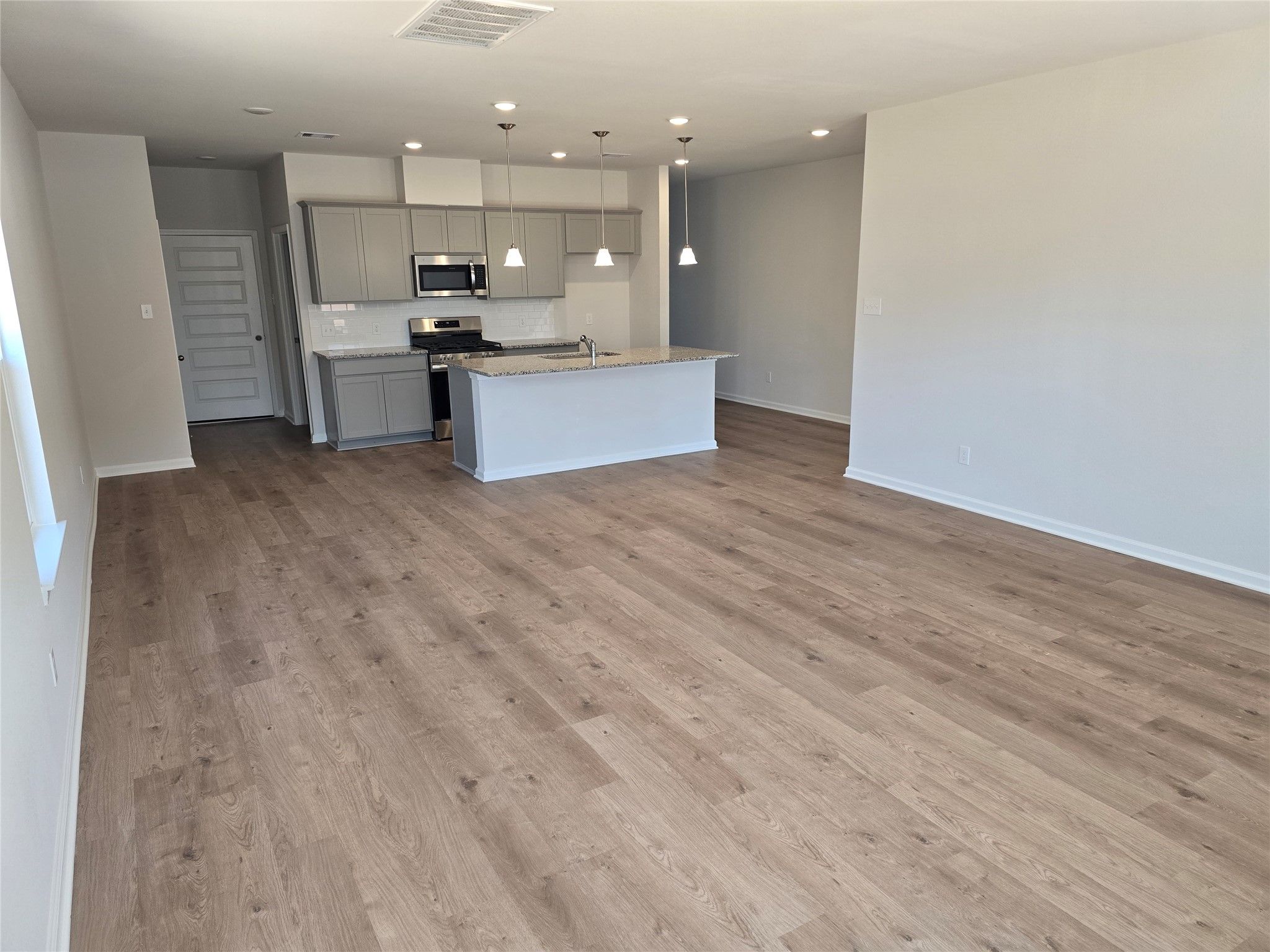 The Shetland III- Family Room into Kitchen. Home under construction, photo used for illustrative pu