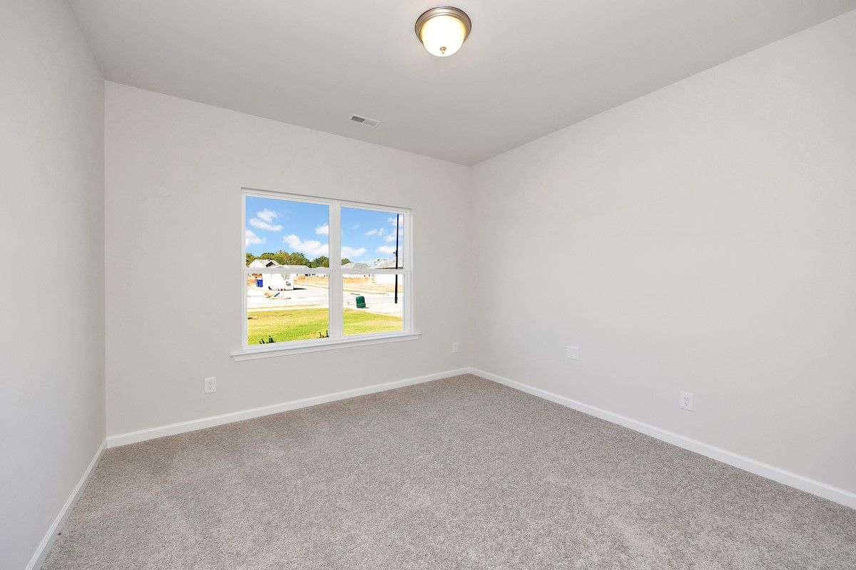 The Avery- Secondary Bedroom. Sample image for illustration; upgrades, options, and colors may vary
