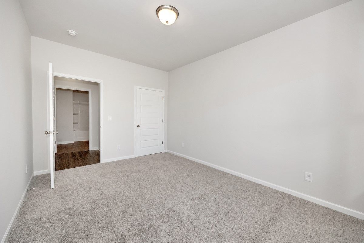 The Avery- Bedroom 2. Sample image for illustration; upgrades, options, and colors may vary.