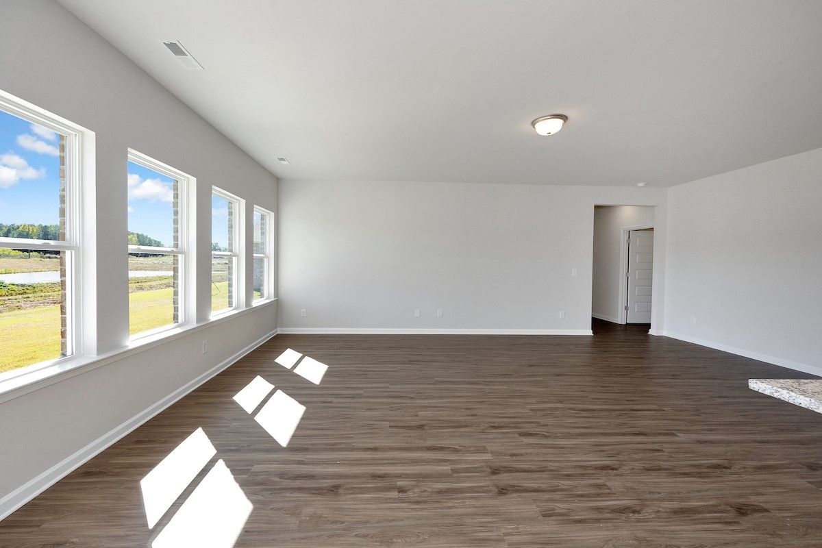 The Avery- Dining Area into Family Room. Sample image for illustration; upgrades, options, and colo