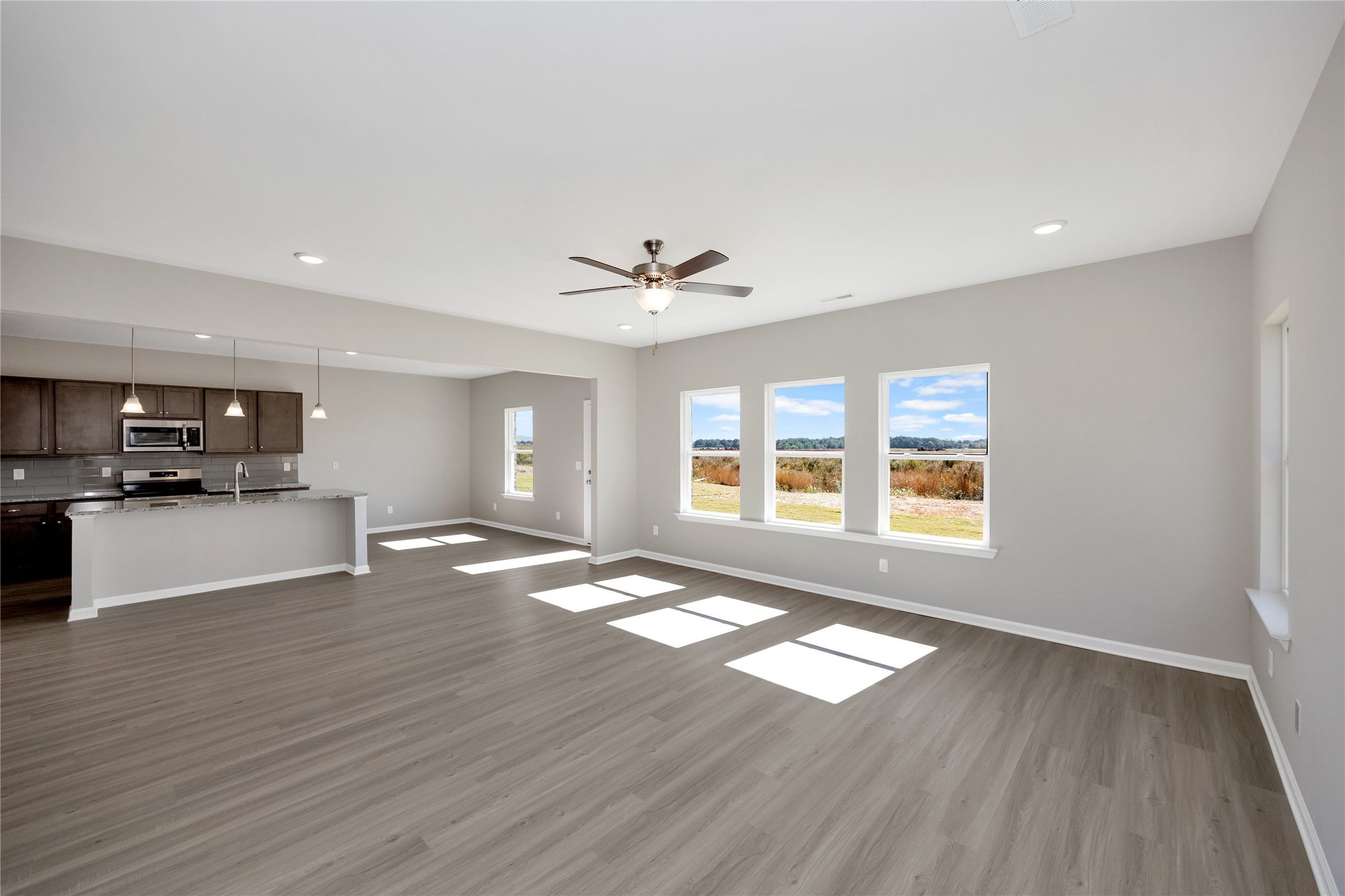 The Harrington- Family Room into the kitchen and breakfast area. Sample image for illustration; upg