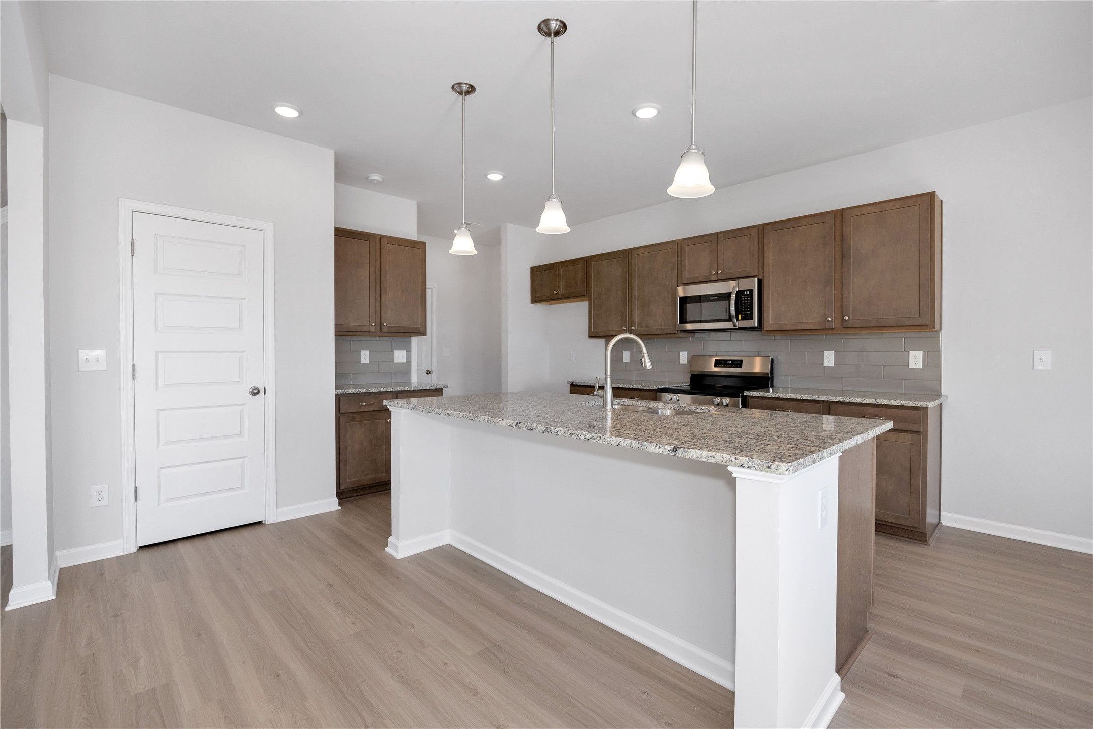 The Harrington- Kitchen. Sample image for illustration; upgrades, options, and colors may vary.