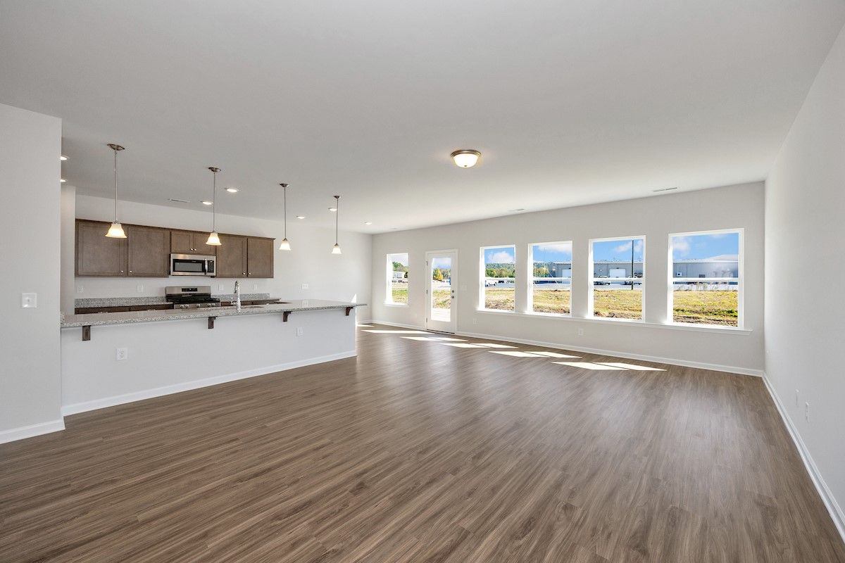 The Avery- Family Room and Dining Area. Sample image for illustration; upgrades, options, and color