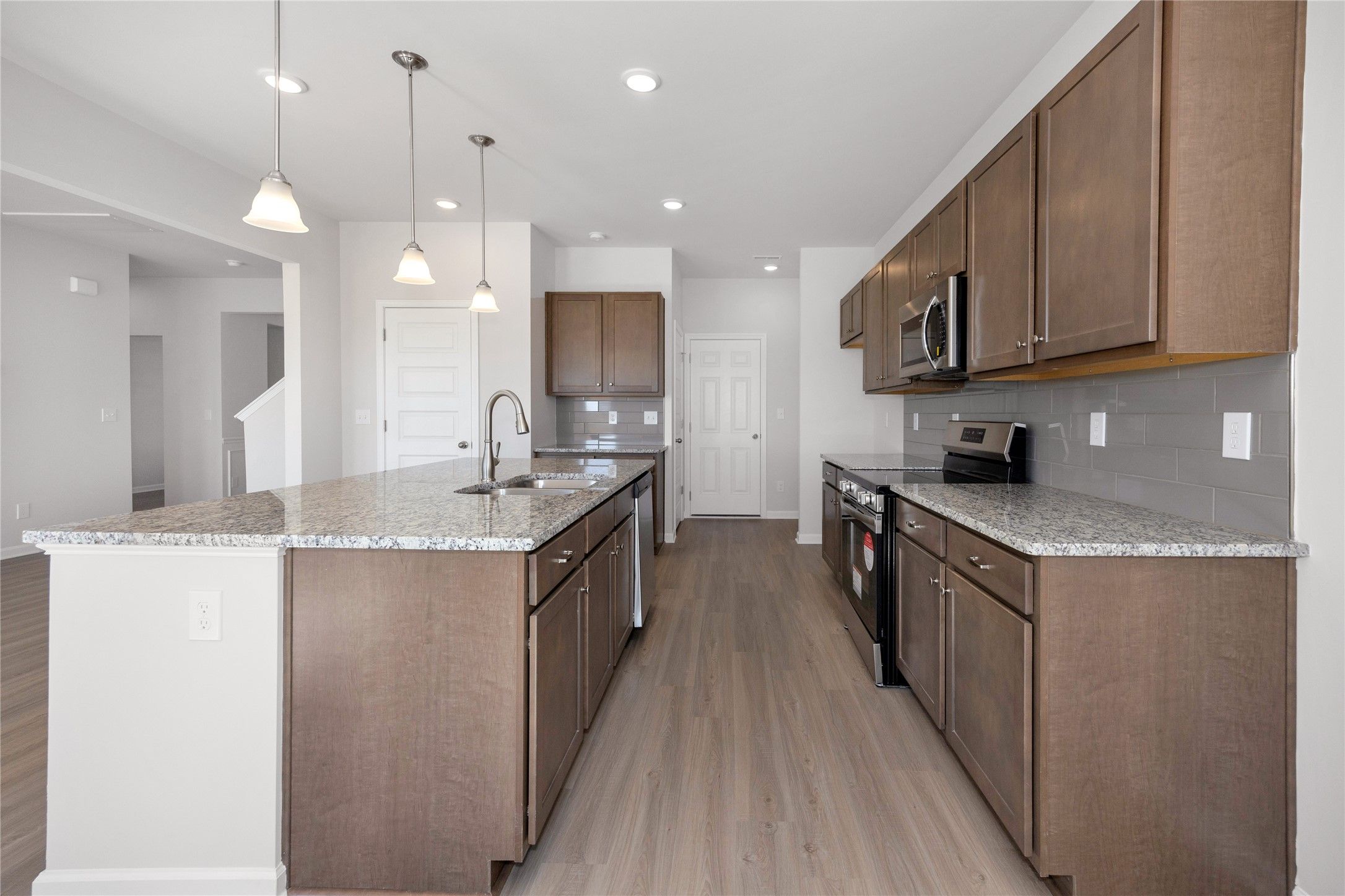 The Harrington- Kitchen. Sample image for illustration; upgrades, options, and colors may vary.