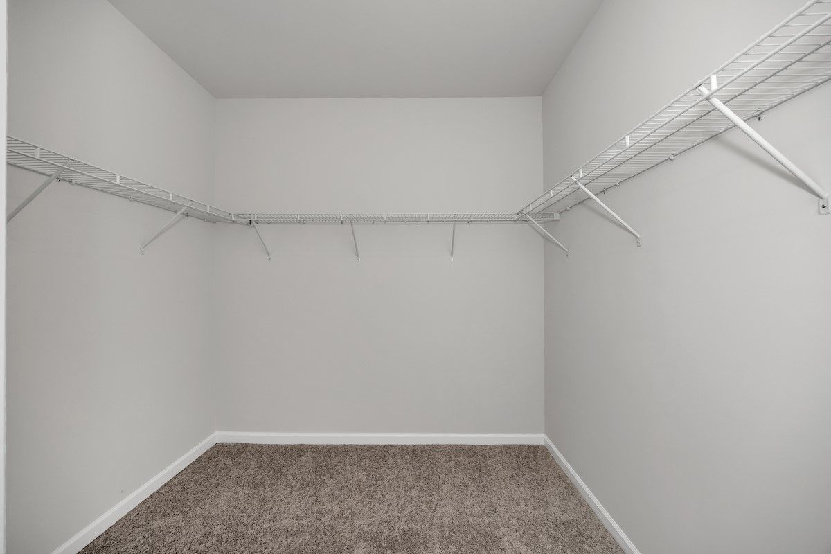 The Avery- Primary Walk-In Closet. Sample image for illustration; upgrades, options, and colors may