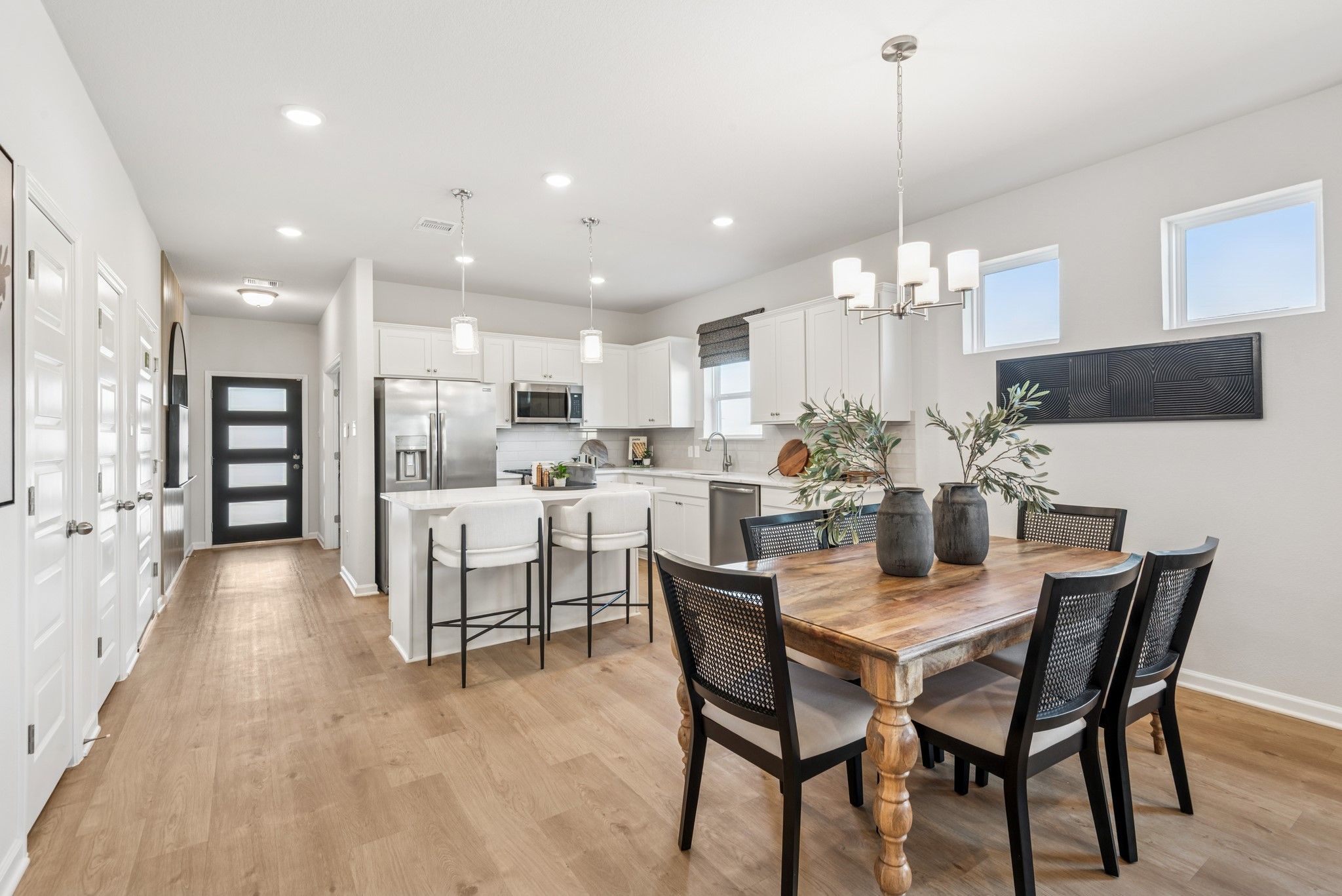 Kitchen and Dining Area. Staged model home shown for illustration only; actual features, colors, an