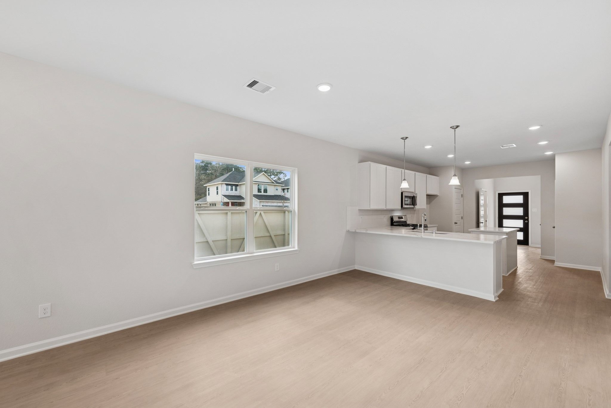 The Cardinal II- Family Room into Dining Area. Photos of home shown are for illustration only; actu