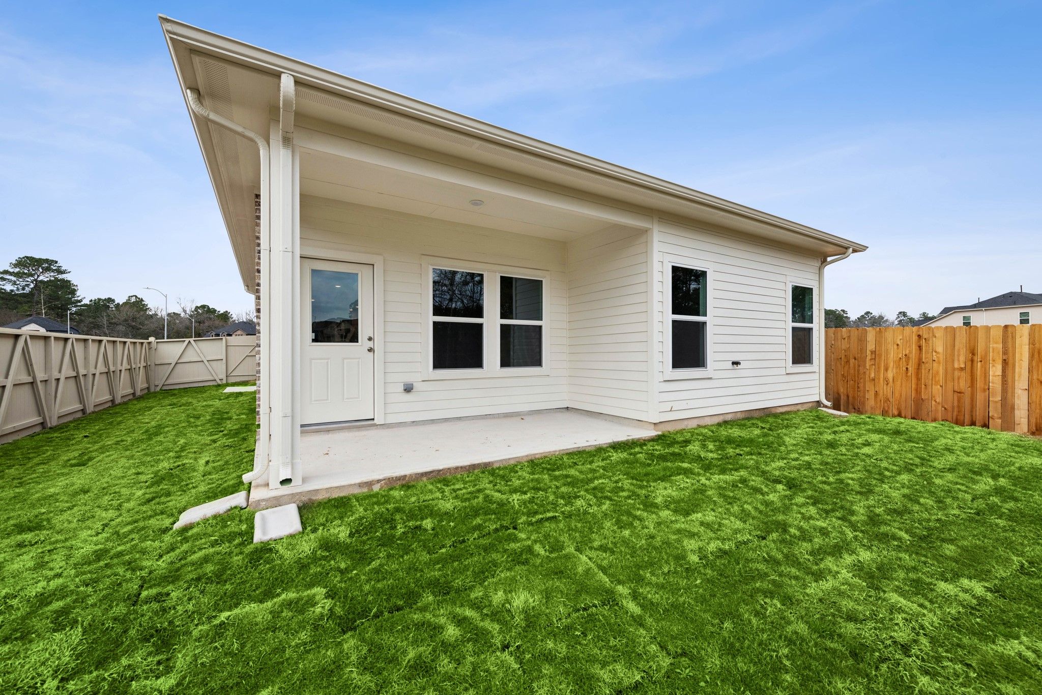 The Cardinal II- Rear Covered Patio. Photos of home shown are for illustration only; actual feature
