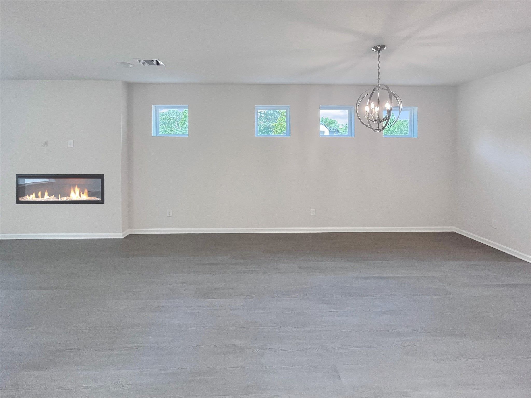 The Robin II- Family Room with Linear Electric Fireplace into the Dining. Sample image to be used f