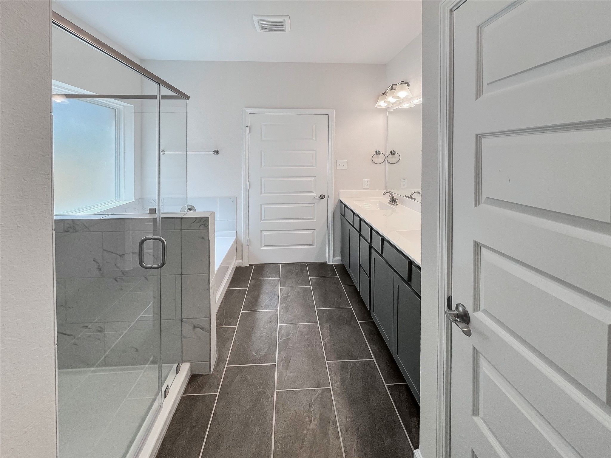 The Robin II- Owner's Bath with Separate Garden Tub and Shower. Sample image for example only.