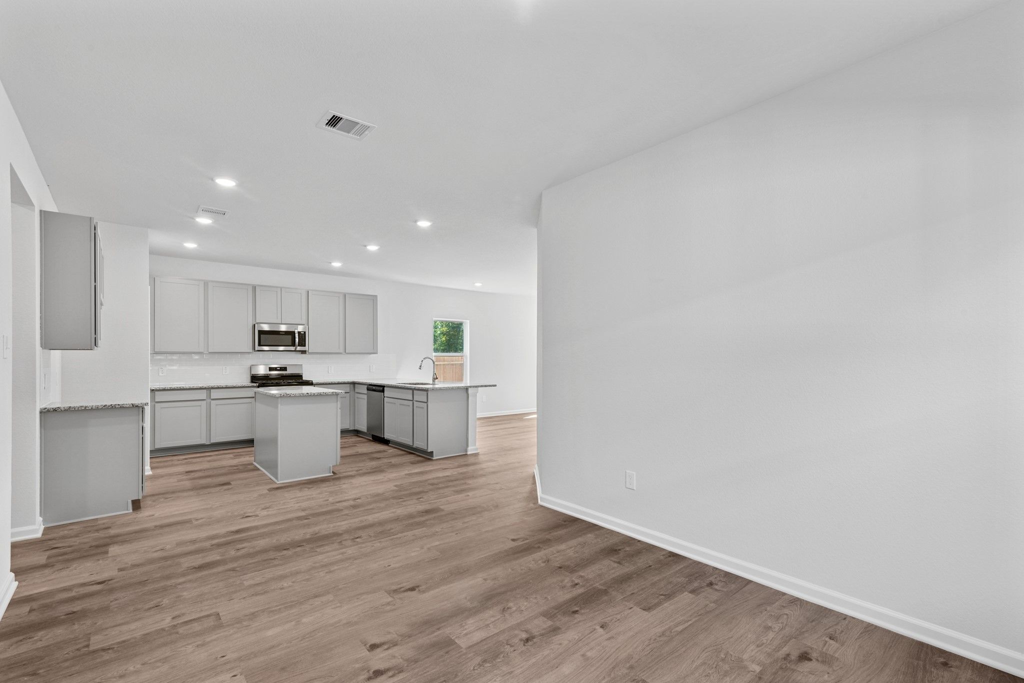 The Sparrow II- Dining into Kitchen. Sample floor plan image for illustration; upgrades, options, a