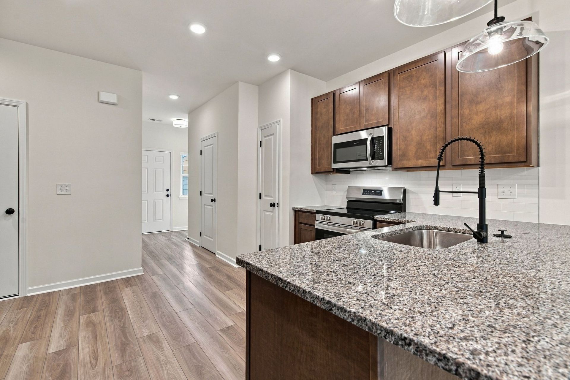 These pictures are of another unit of the same floor plan. Design selections will vary.