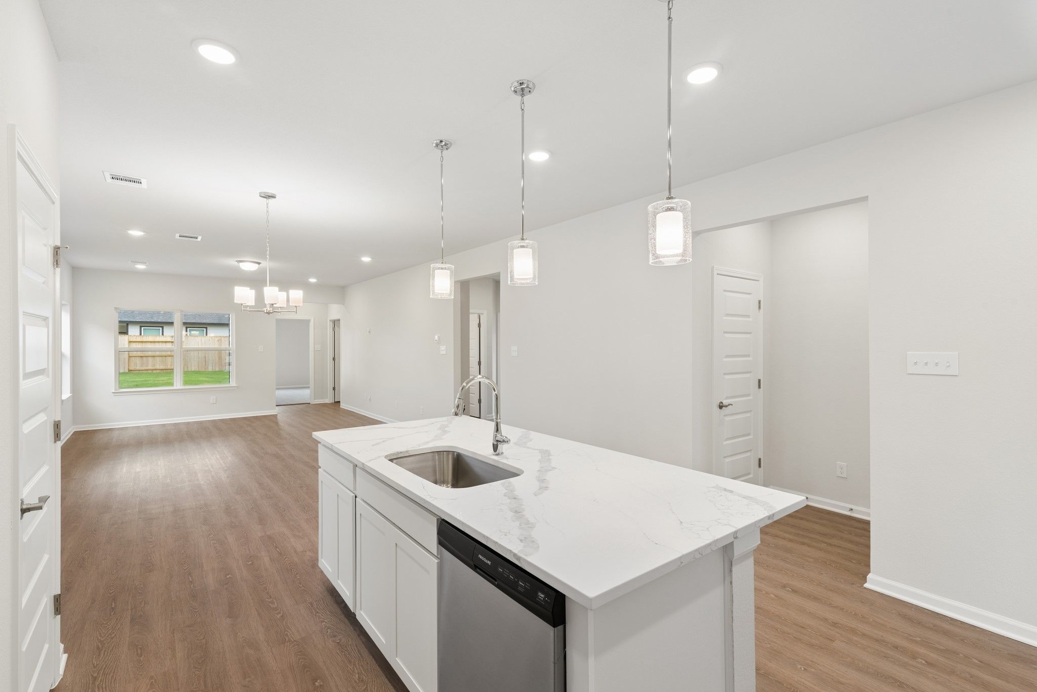 The Oakshire II- Kitchen into Dining Area. Home under construction, photo used for illustrative pur
