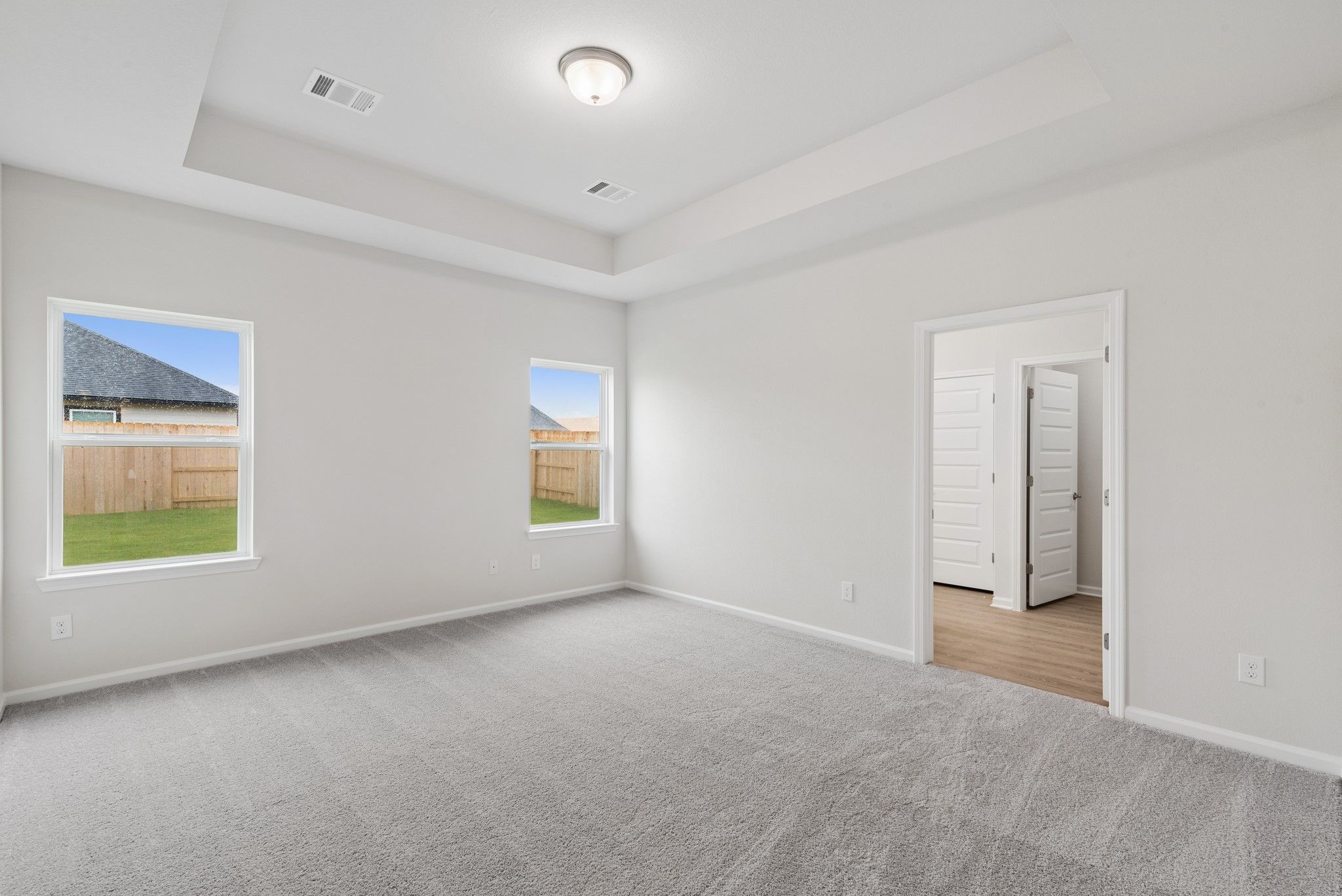 The Oakshire II- Primary Bedroom with Tray Ceiling. Home under construction, photo used for illustr