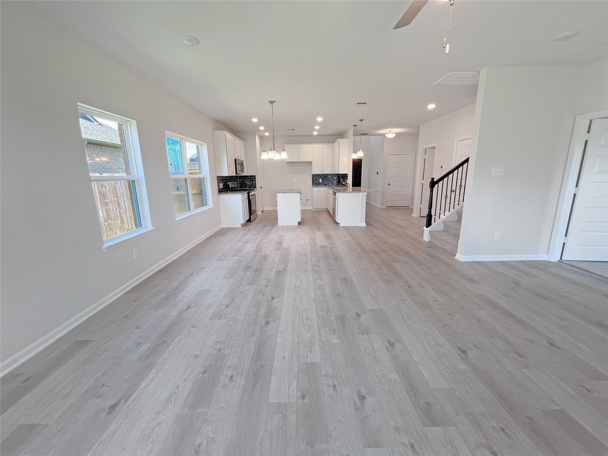 The Georgetown II- Family Room into Dining. Sample image for illustration; upgrades, options, and c